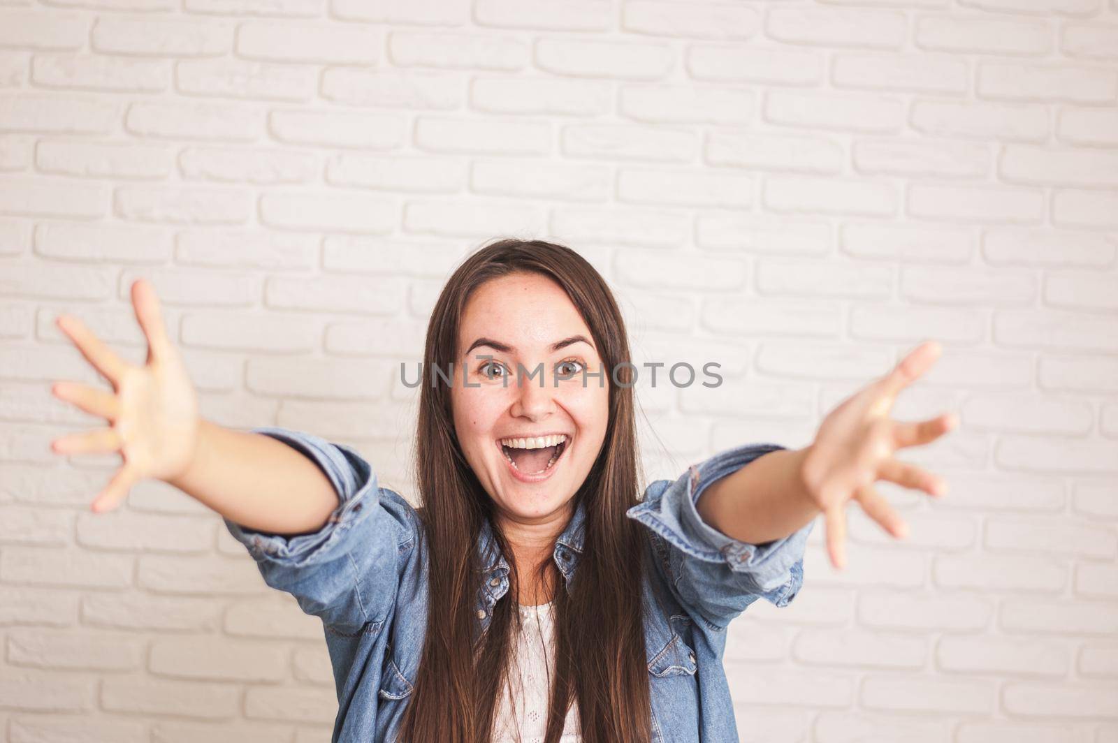 positive woman smiling on a light background by maramorosz