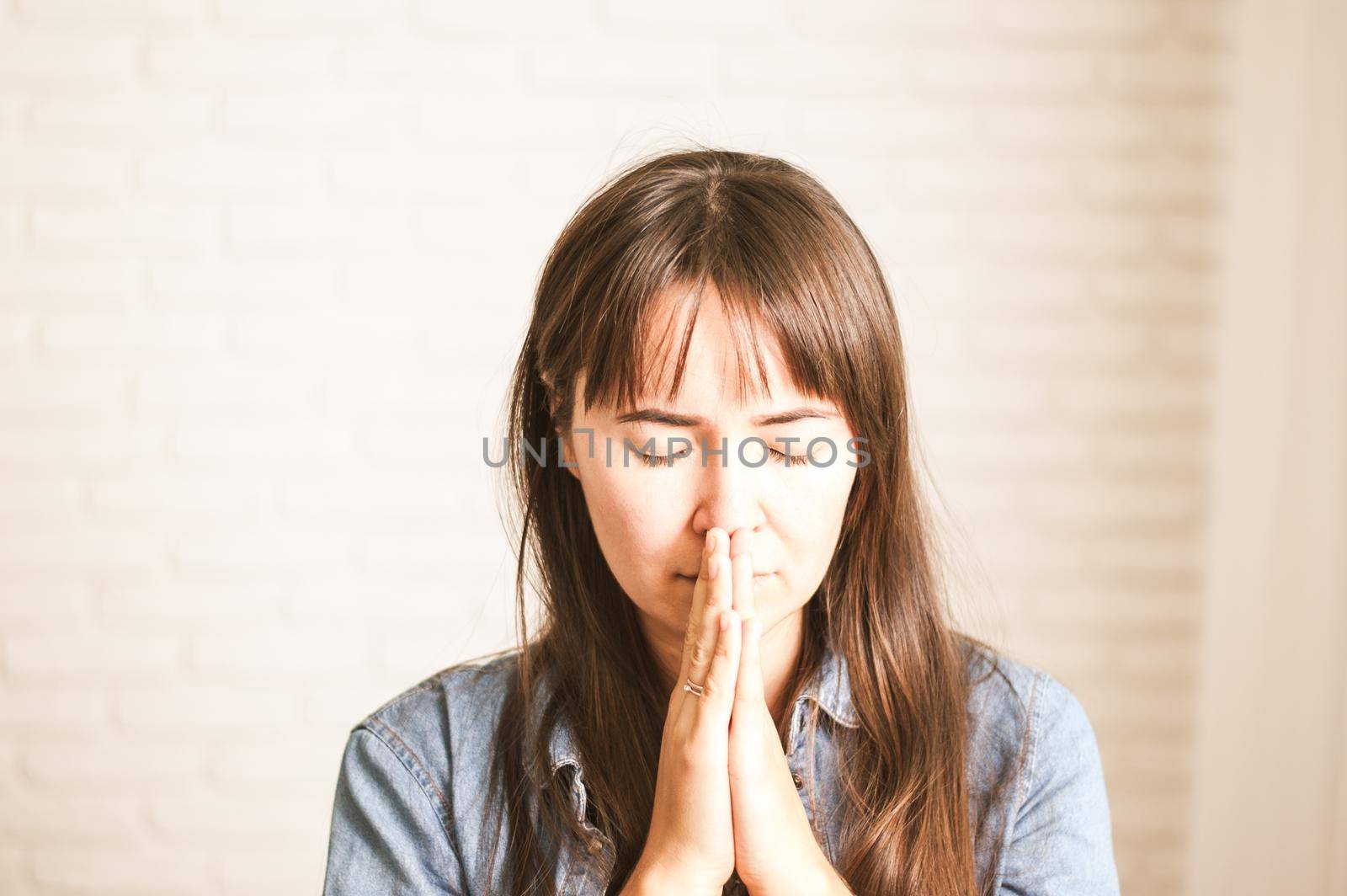 upset emotional woman on a light background by maramorosz