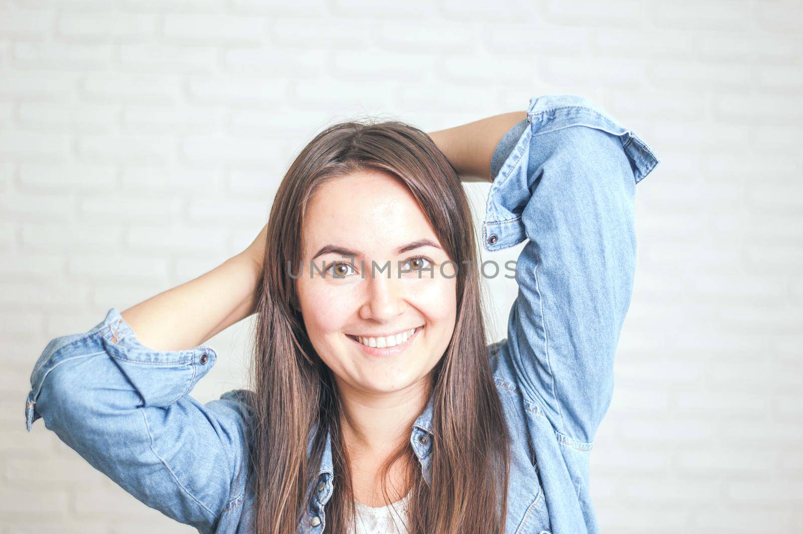 positive woman smiling on a light background by maramorosz