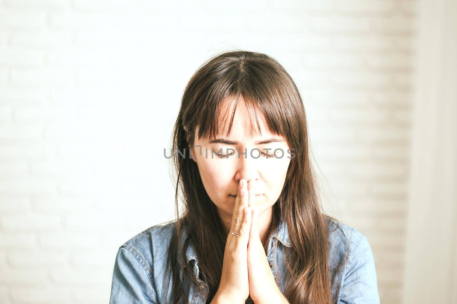 upset emotional woman on a light background. High quality photo