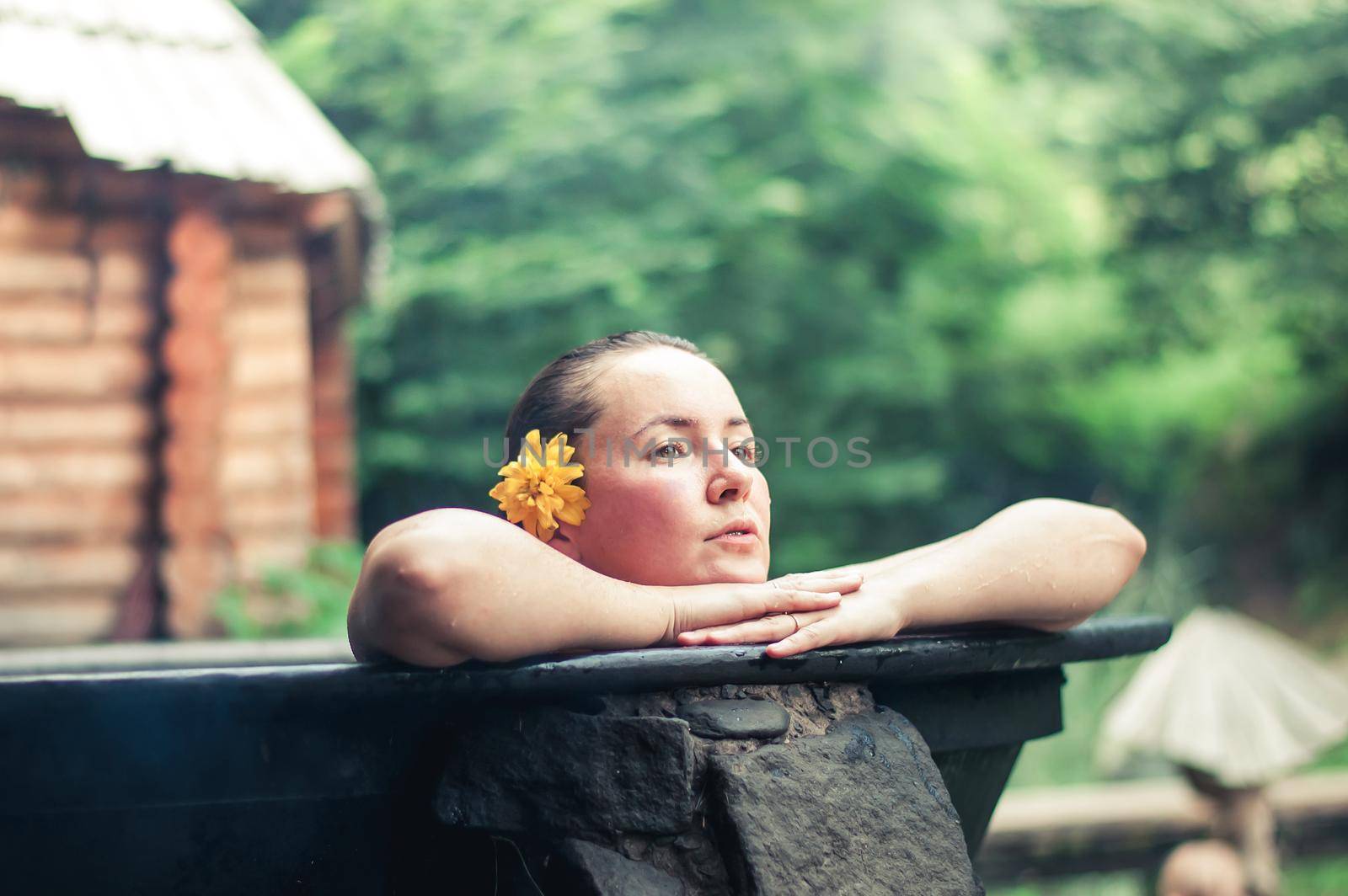 woman enjoying spa in hot tubs outdoors. High quality photo