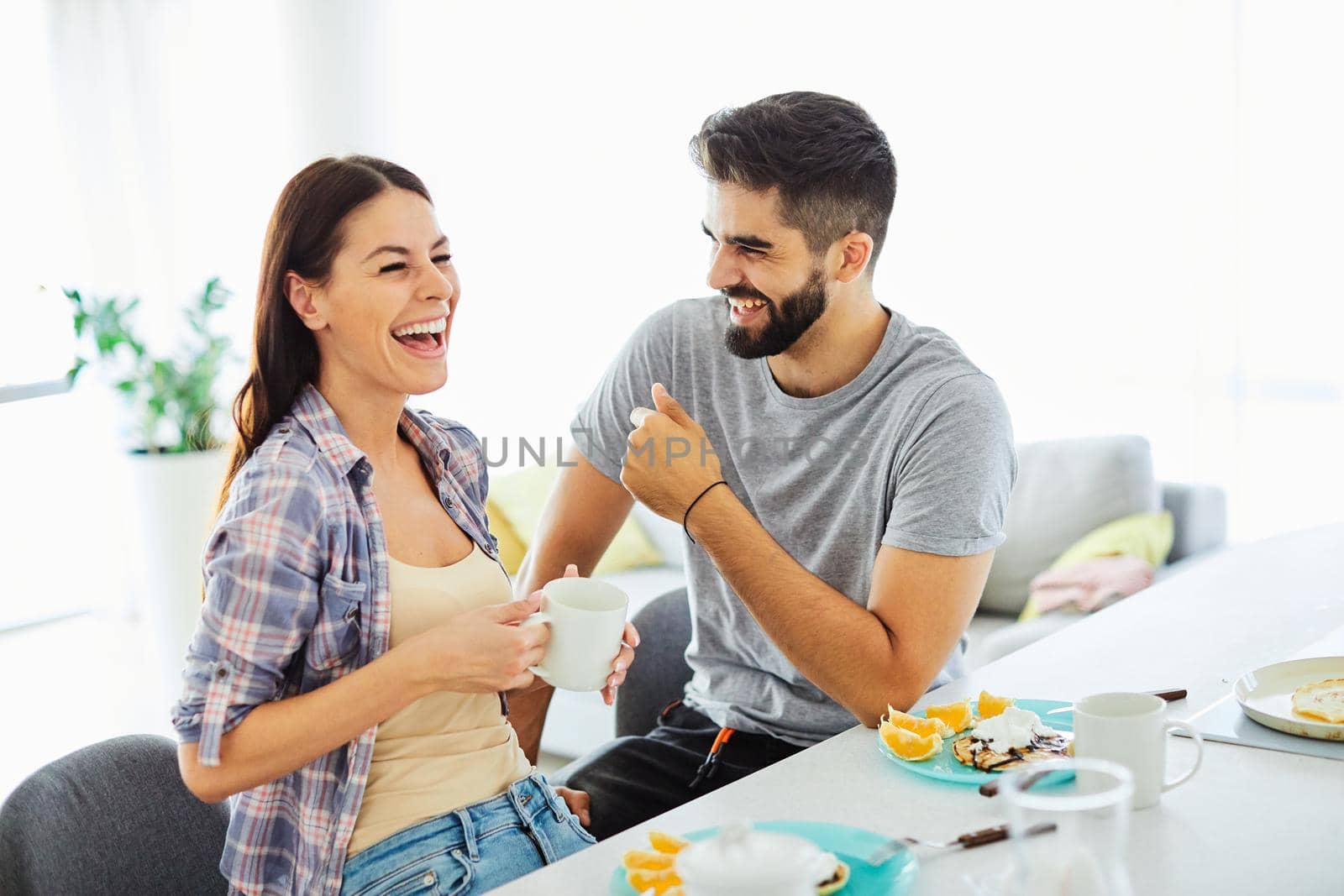 Portrait of a lovely young couple together at home