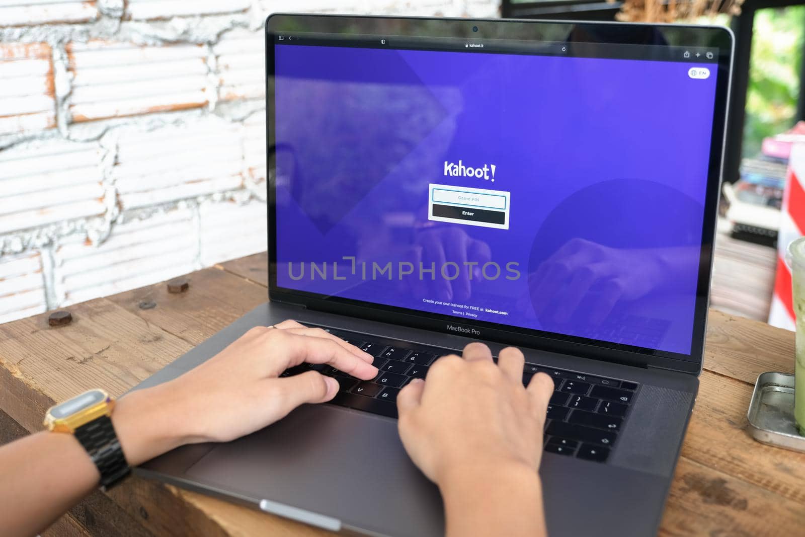 Chiangmai, Thailand - JUNE 06, 2021:person using Laptop computer displaying logo of Kahoot, a game-based learning platform. by Manastrong