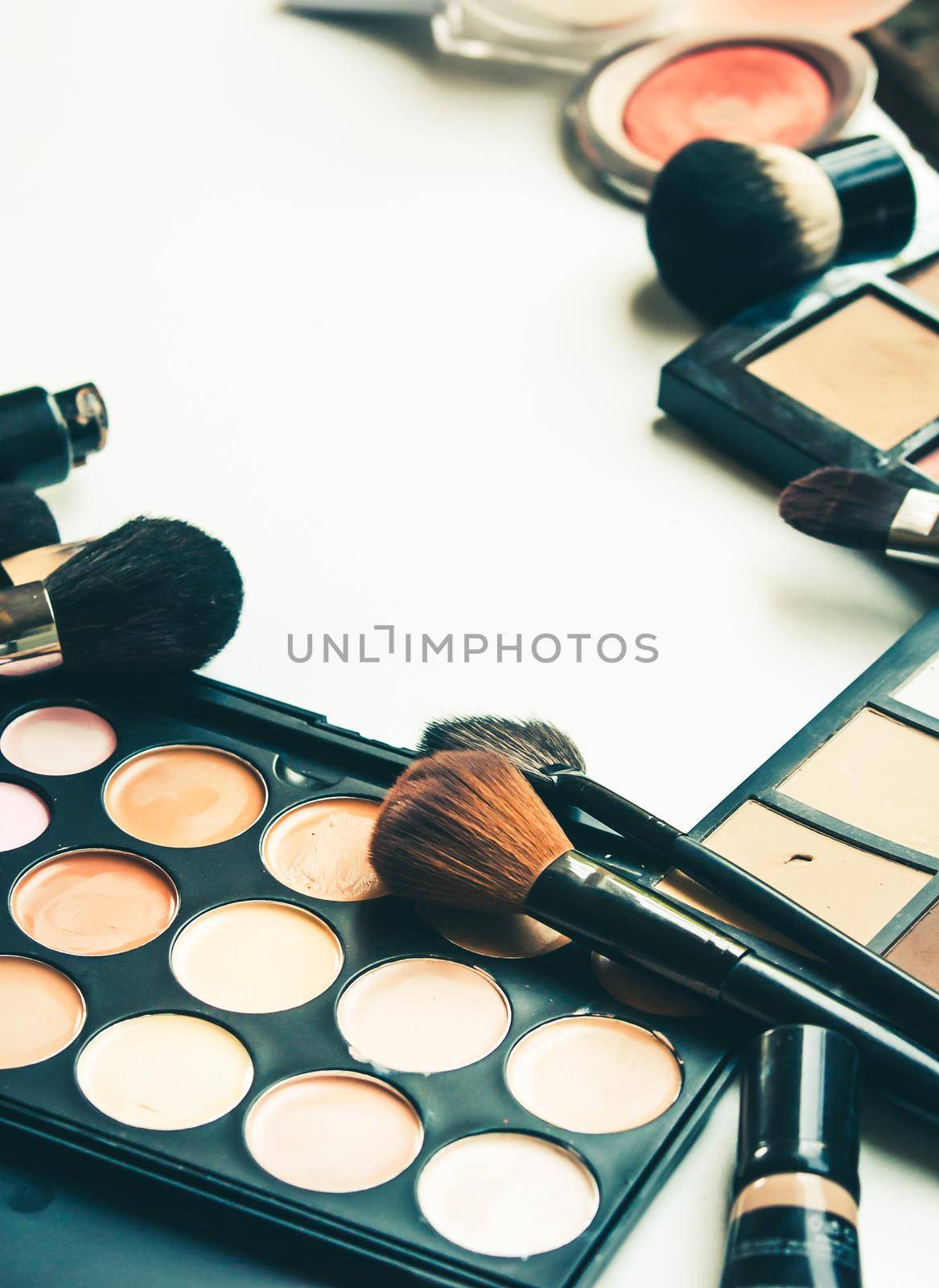 palette of cosmetics for naked make up with professional brushes