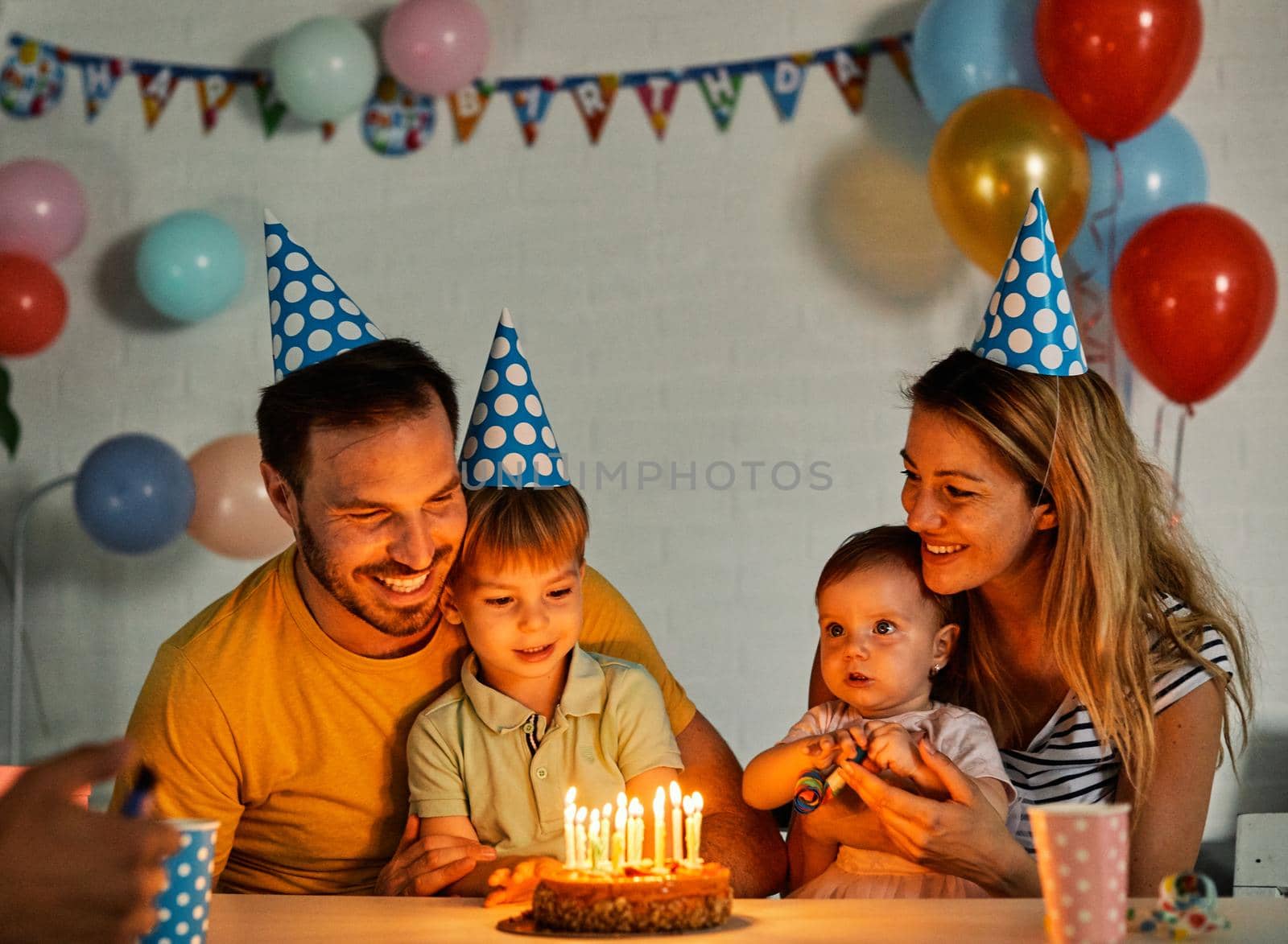 Happy family celebrating a birthday together at table at home