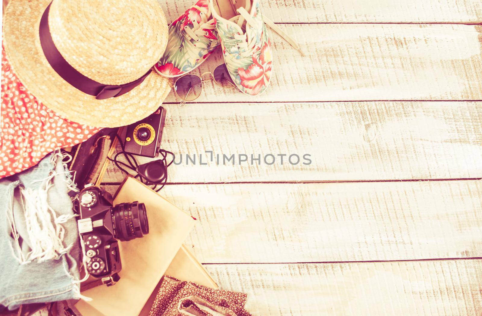 retro bag for summer vocation with photo camera, book and wicker hat. High quality photo