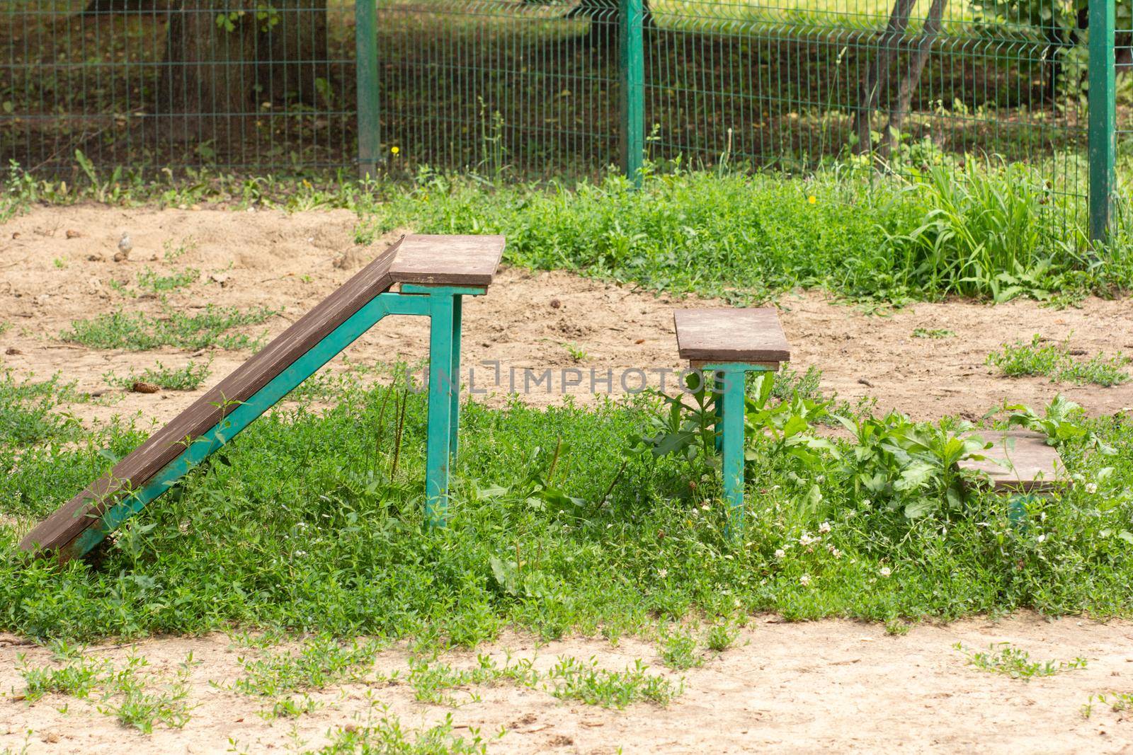 Wooden bar jump hurdles wall barriers of different height for dog training in park for dog