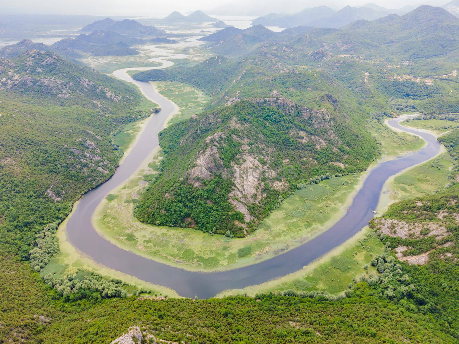 Canyon of Rijeka Crnojevica river near the Skadar lake coast. One of the most famous views of Montenegro. River makes a turn between the mountains and flows backward.