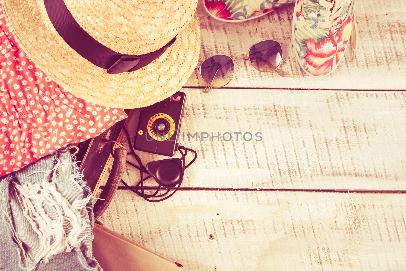 retro bag for summer vocation with photo camera, book and wicker hat. High quality photo