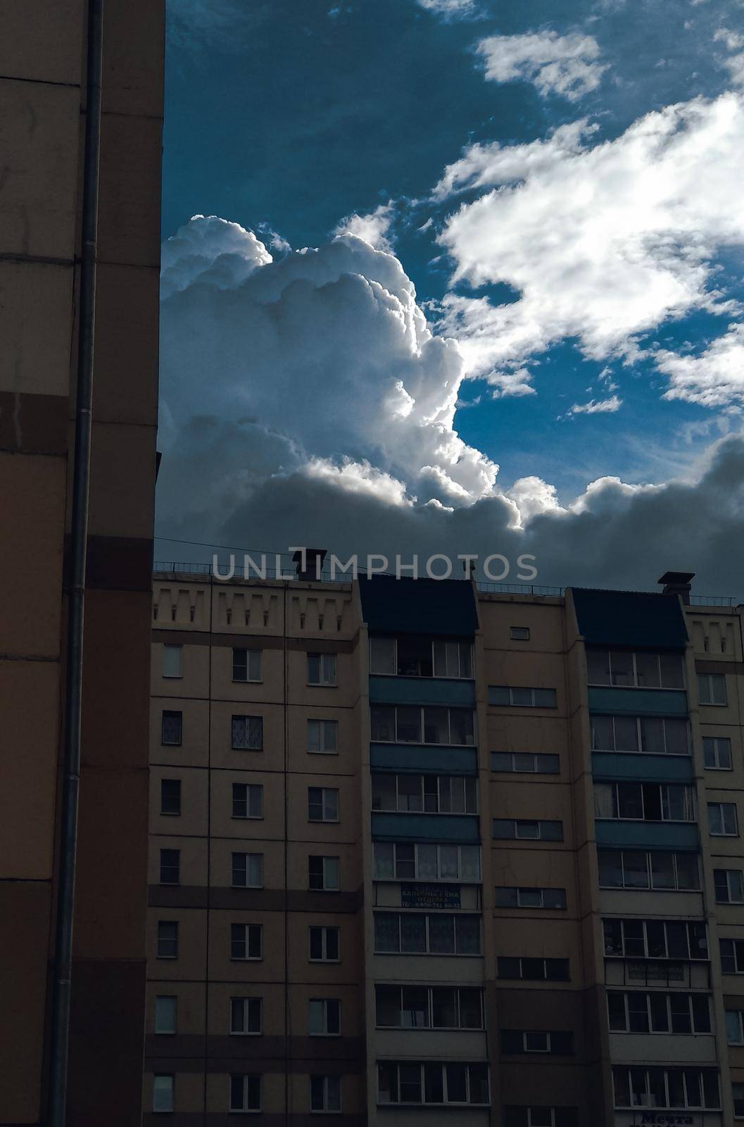 Thick clouds over a multi-storey building