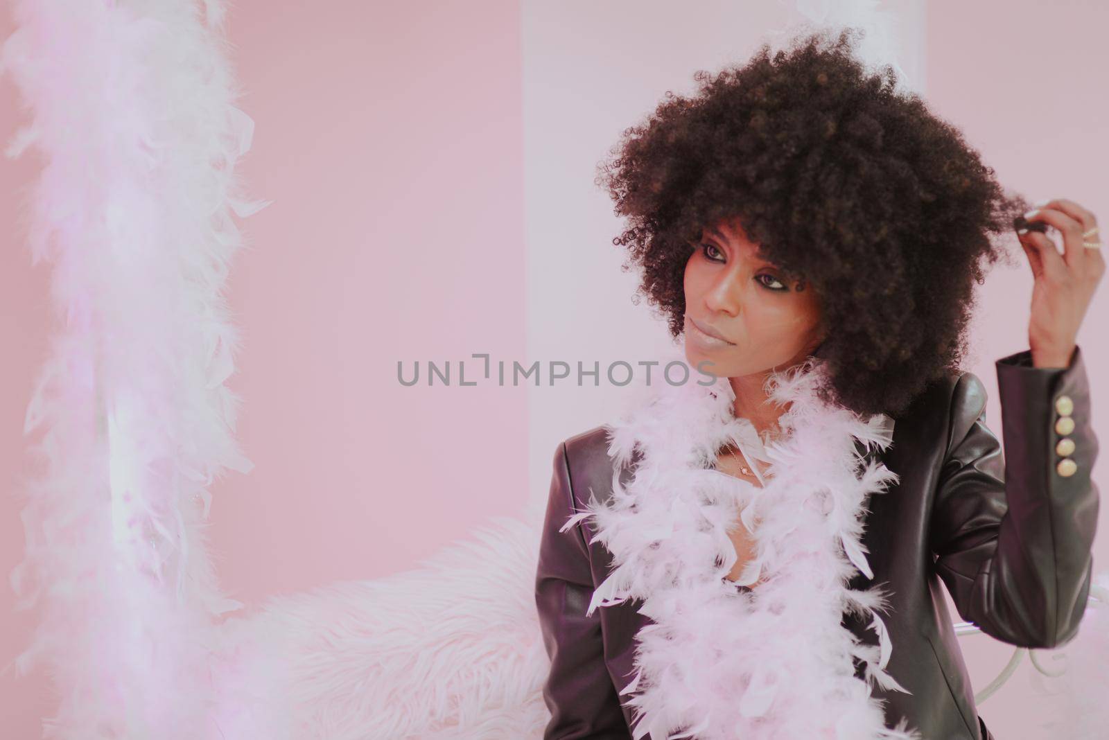 Young attractive African woman with happy cheerful smile having fun in studio