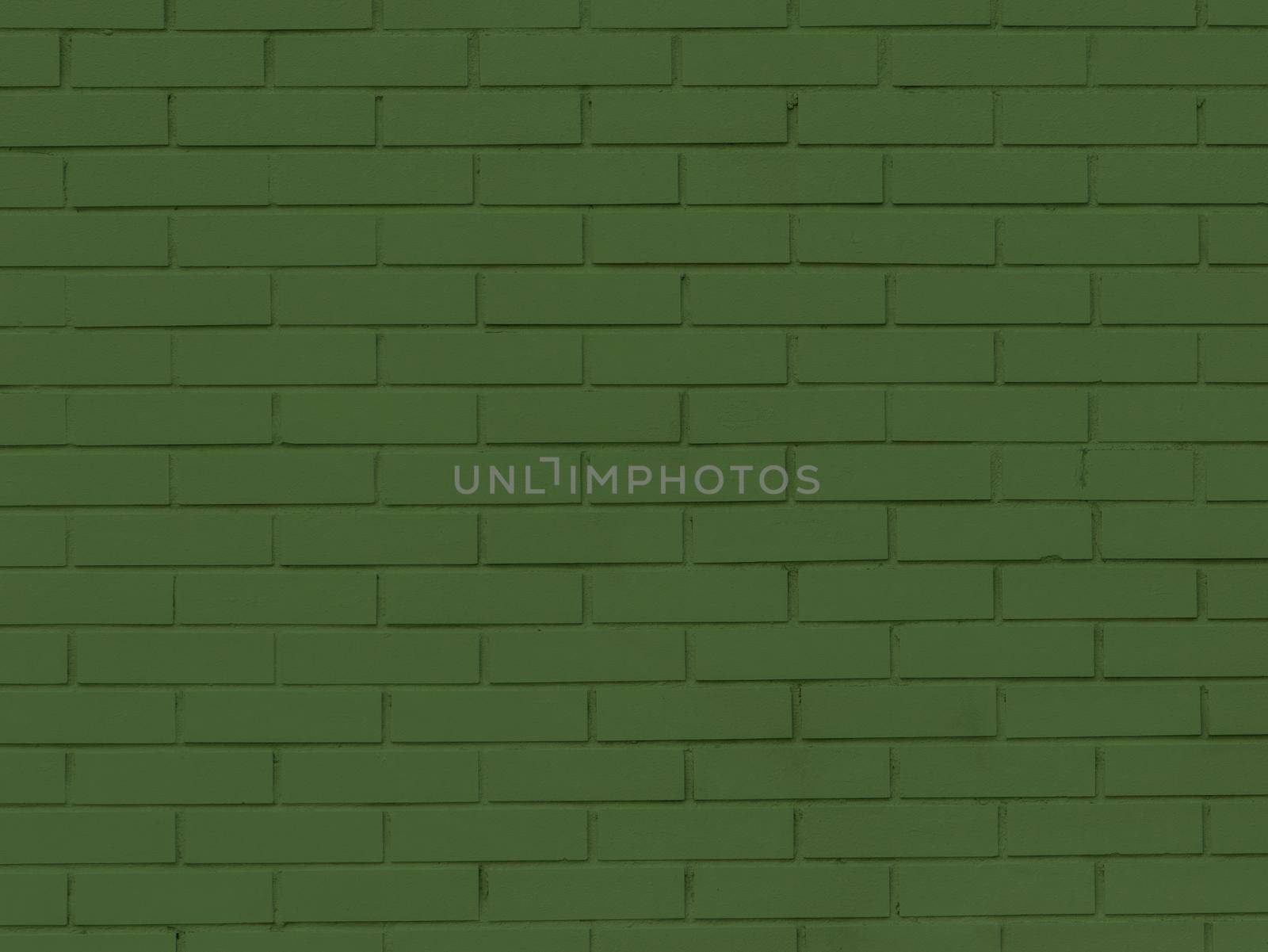 Panoramic solid old green brick wall.