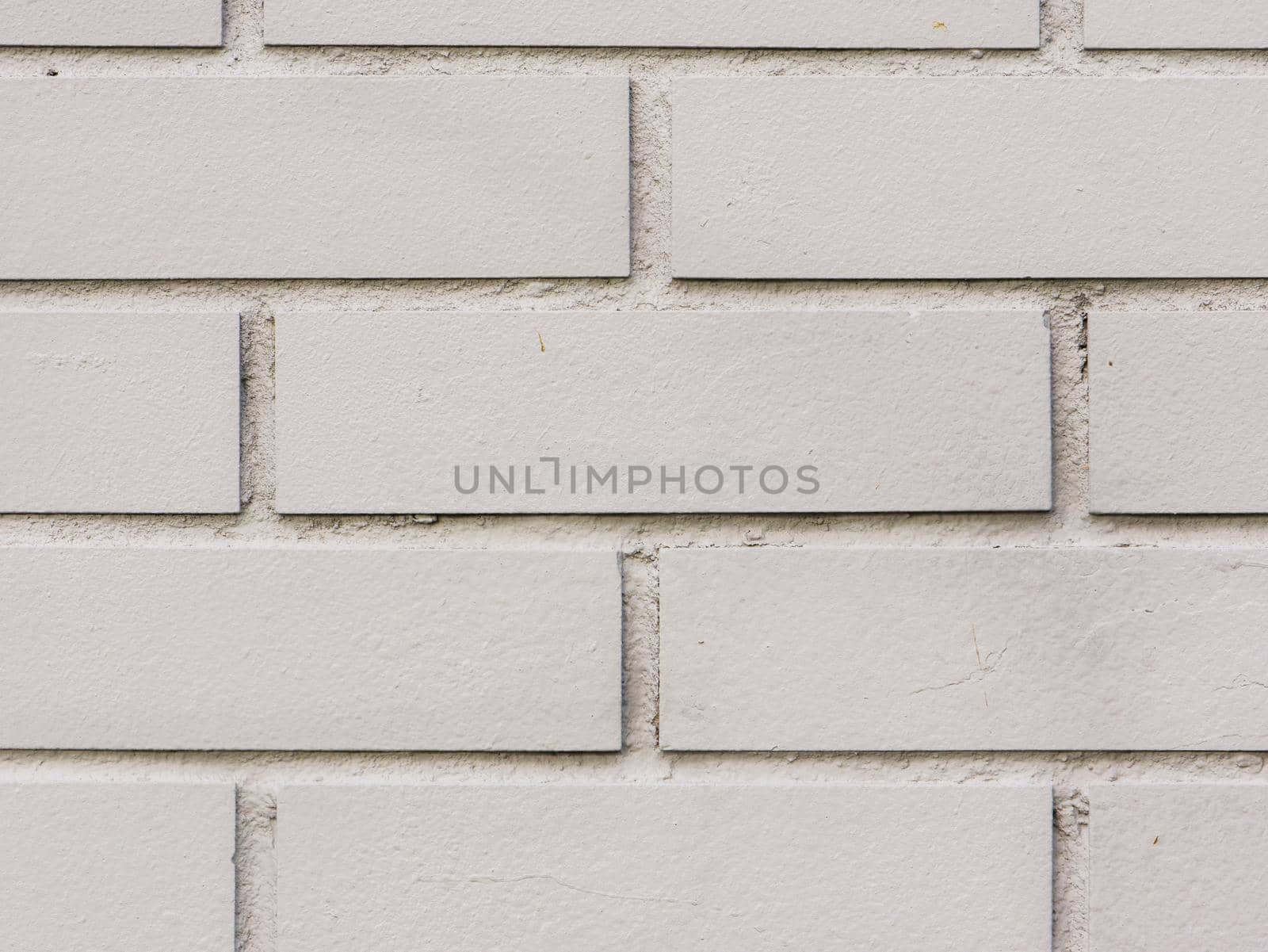 Abstract background of a gray brick wall close-up.