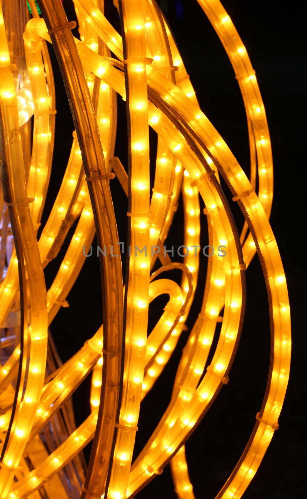 Yellow decorative festive garlands.Fragment of festive illumination.