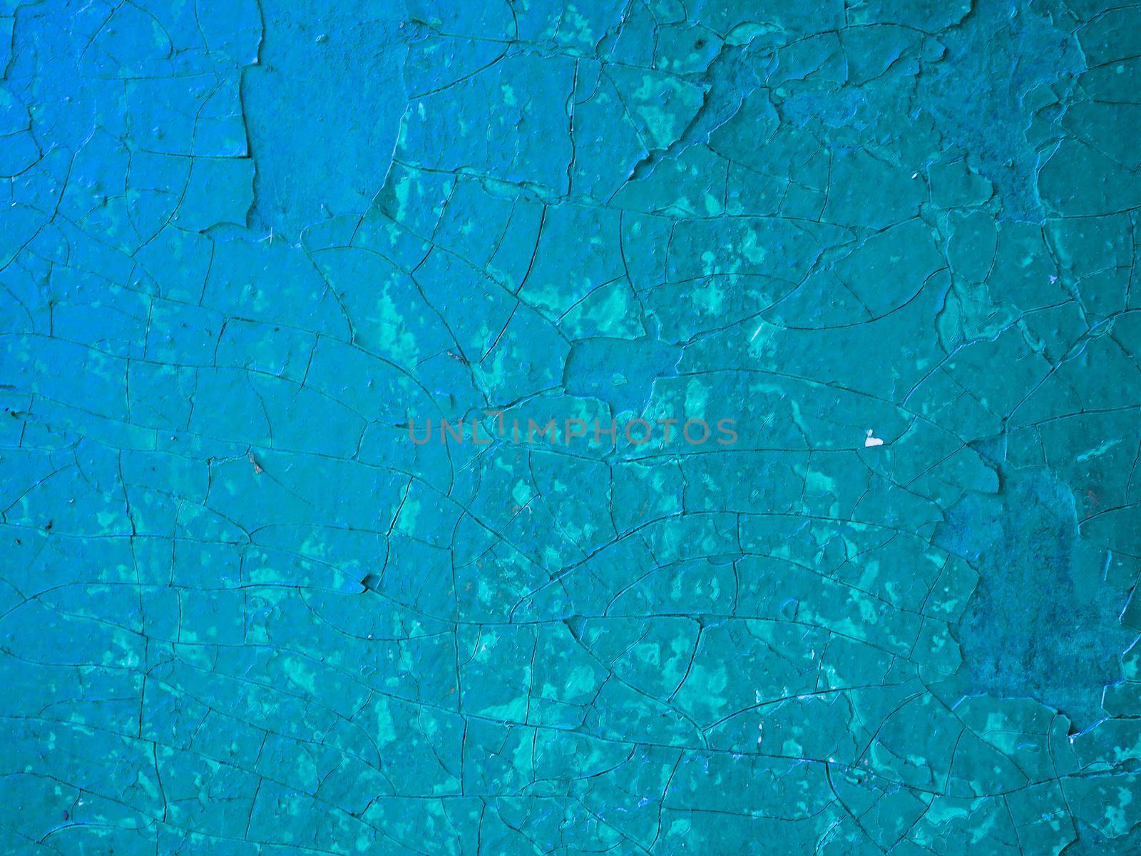 Texture of the plaster.Abstract background old paint. Wall with old shabby blue paint.