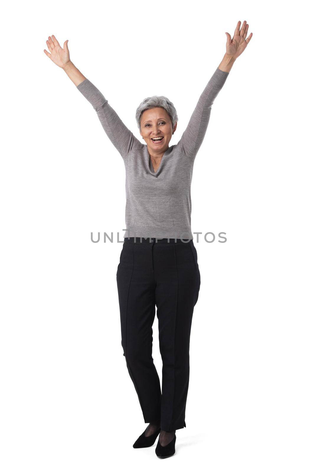 Mature asian business woman winner with raised arms isolated on white background full length studio portrait