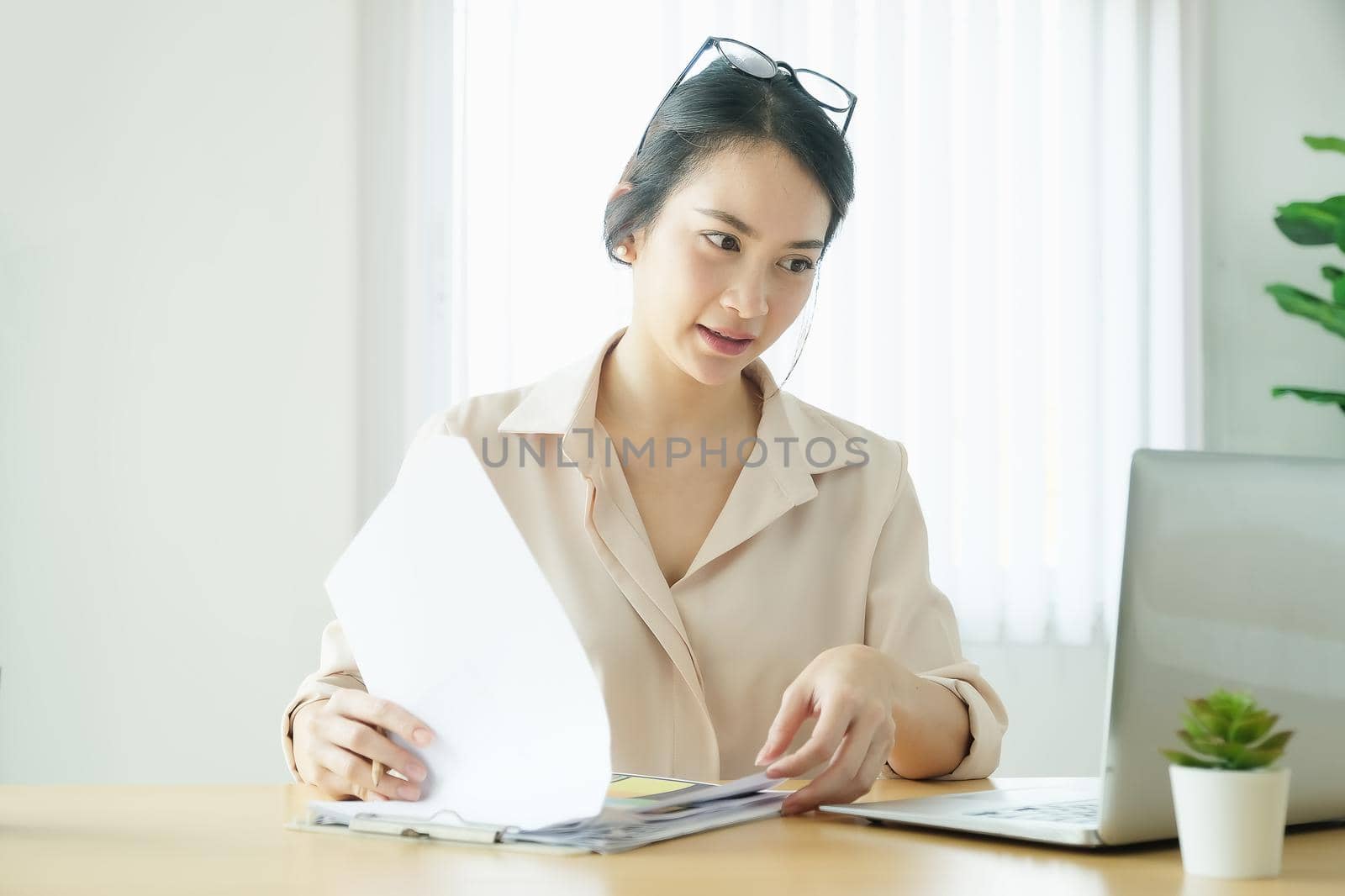 new normal, a businesswoman using computer to work for a company Via the internet on your desk at home.