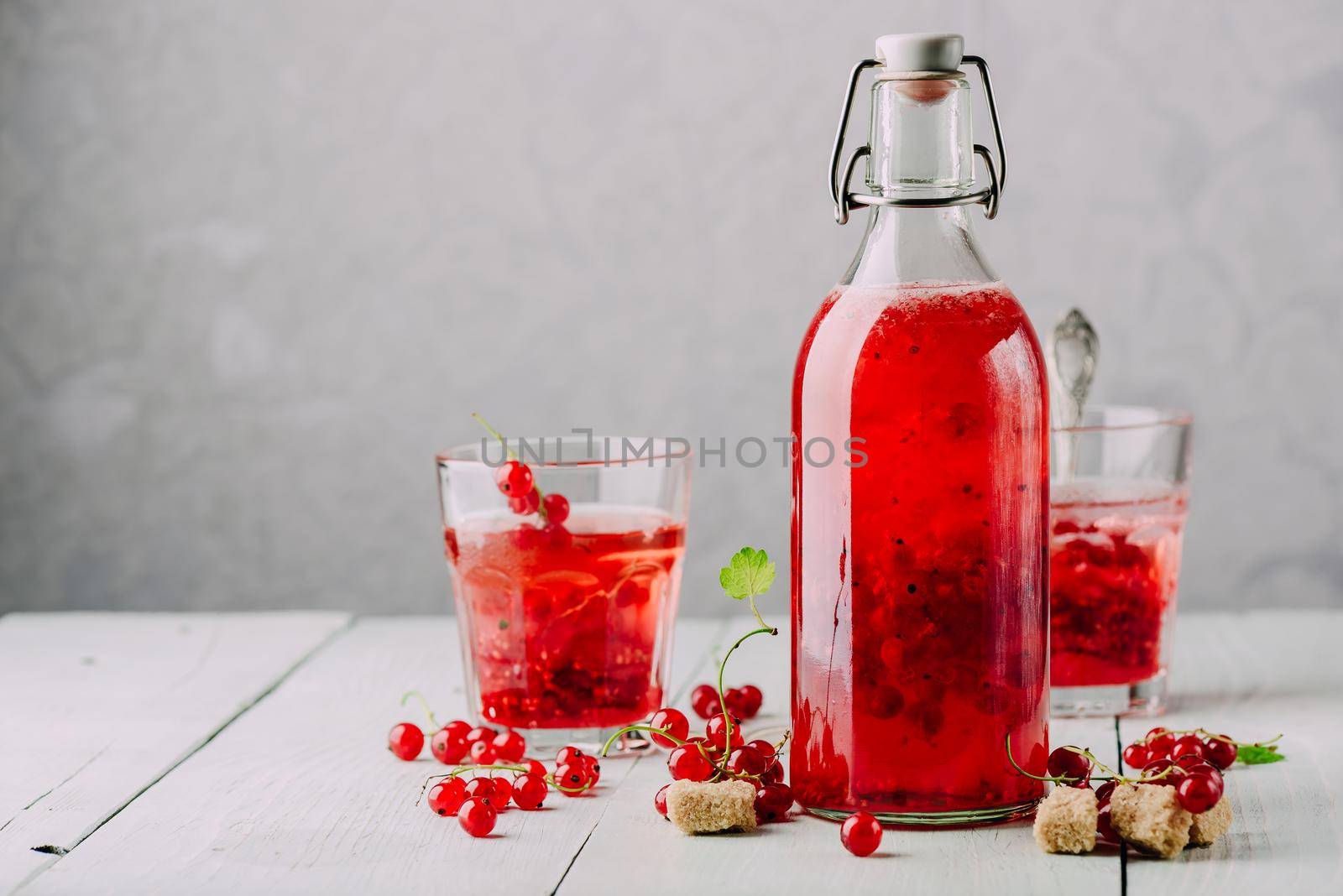 Infused water with fresh red currant and cane sugar