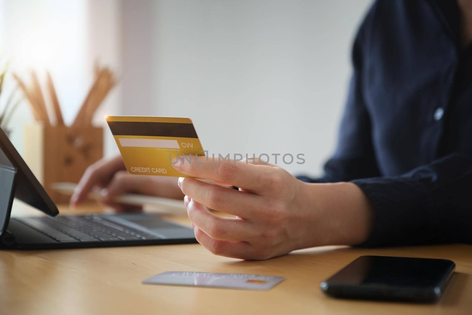 Online payment, Young Women's hands holding credit card and using tablet for online shopping