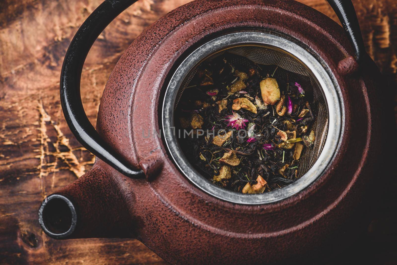 Preparing herbal tea with fruit pieces. High angle view