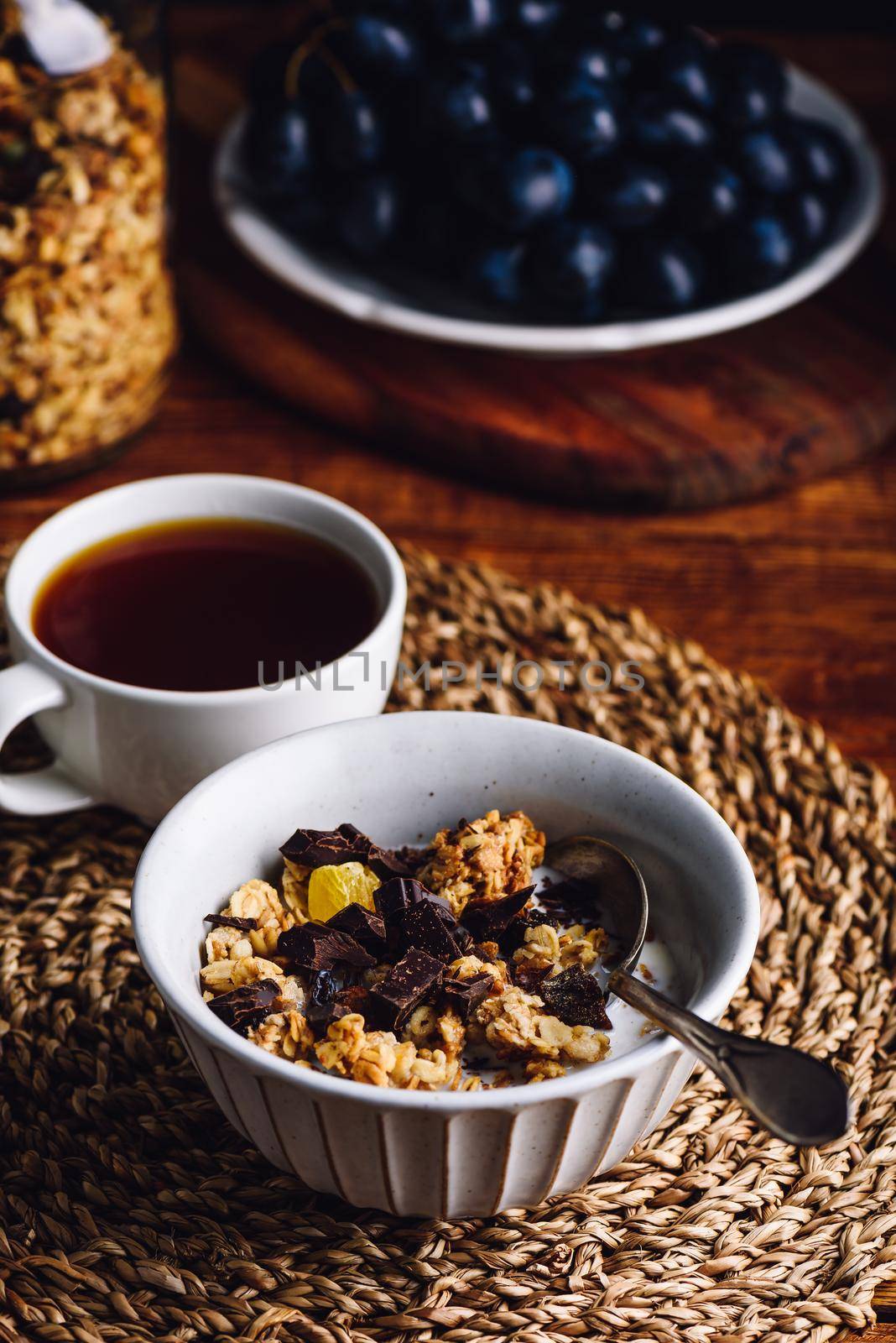 Bowl with Granola, Dried Fruits and Chocolate by Seva_blsv