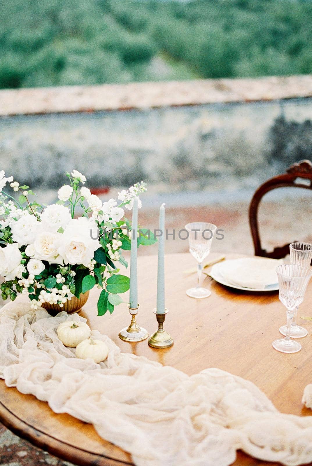 Laid festive table with candles and glasses. High quality photo