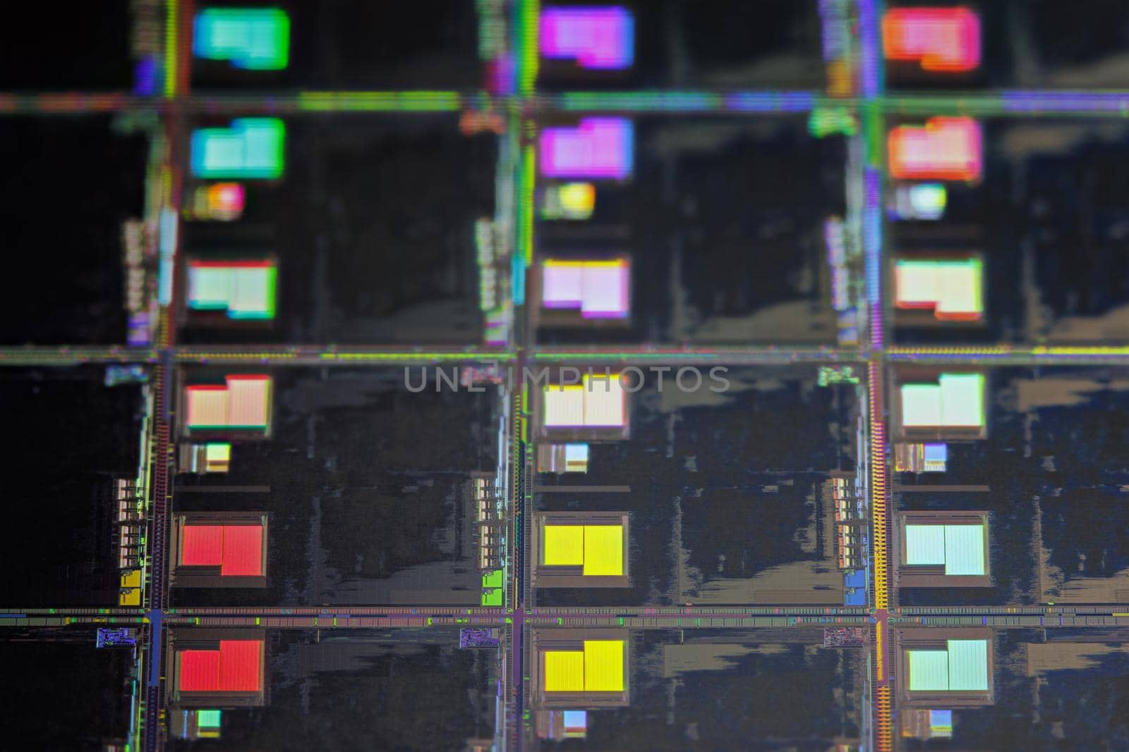 Silicon monocrystalline wafer with microchips after photolithography etching manufacturing used in fabrication of electronic integrated circuits. Full-frame high-tech macro background.