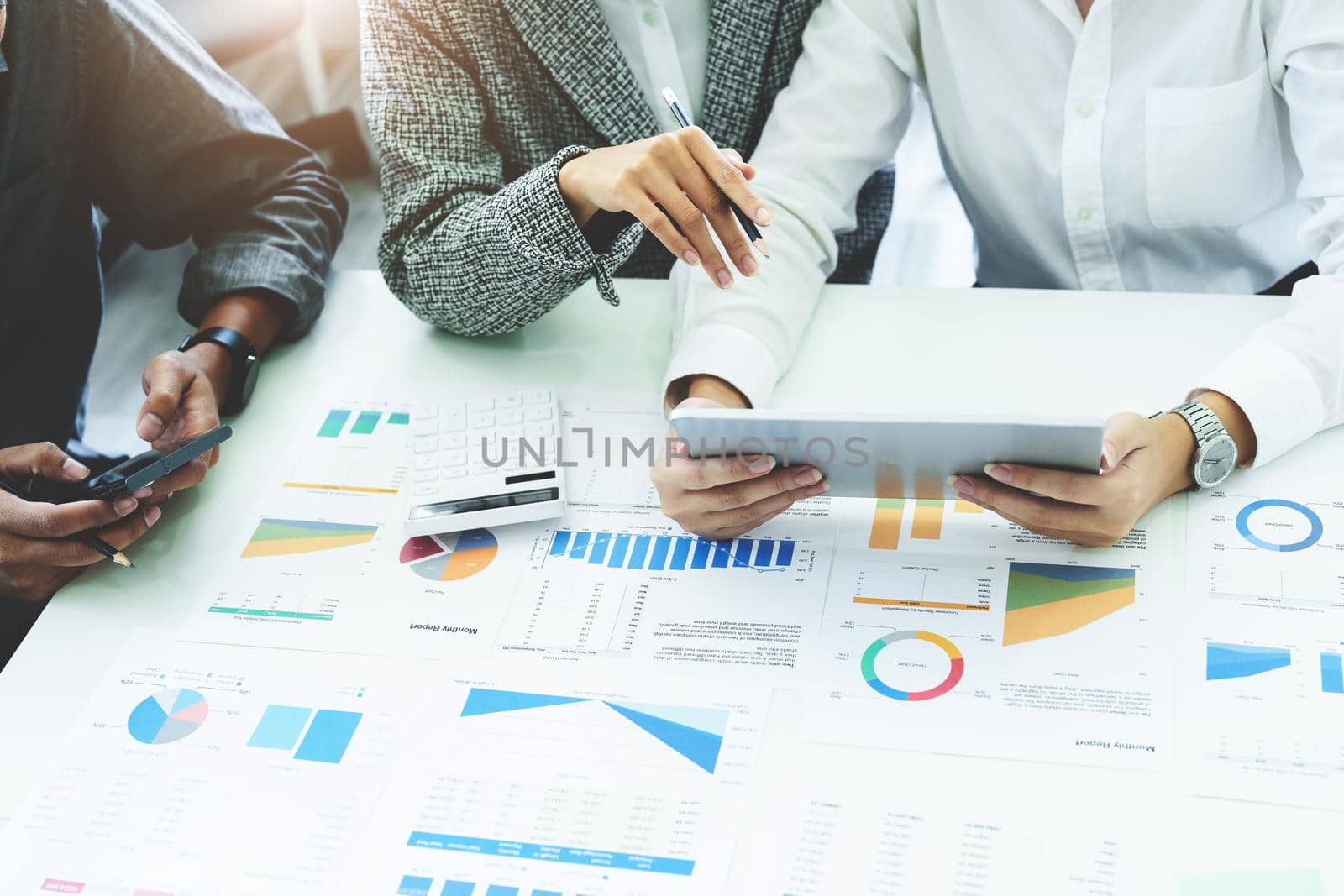 Planning to reduce investment risks, the image of a group of businesspeople working with partners is adjusting marketing strategies to analyze profitable and targeted customer needs at meetings by Manastrong