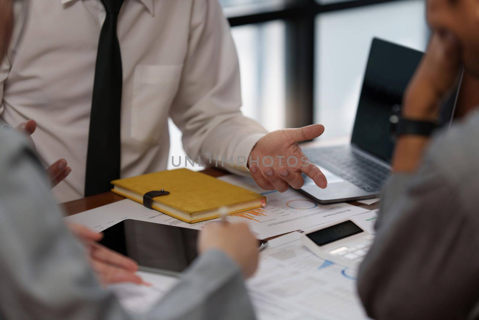 Business woman and lawyers discussing contract papers with brass scale on wooden desk in office. Law, legal services, advice, Justice concept