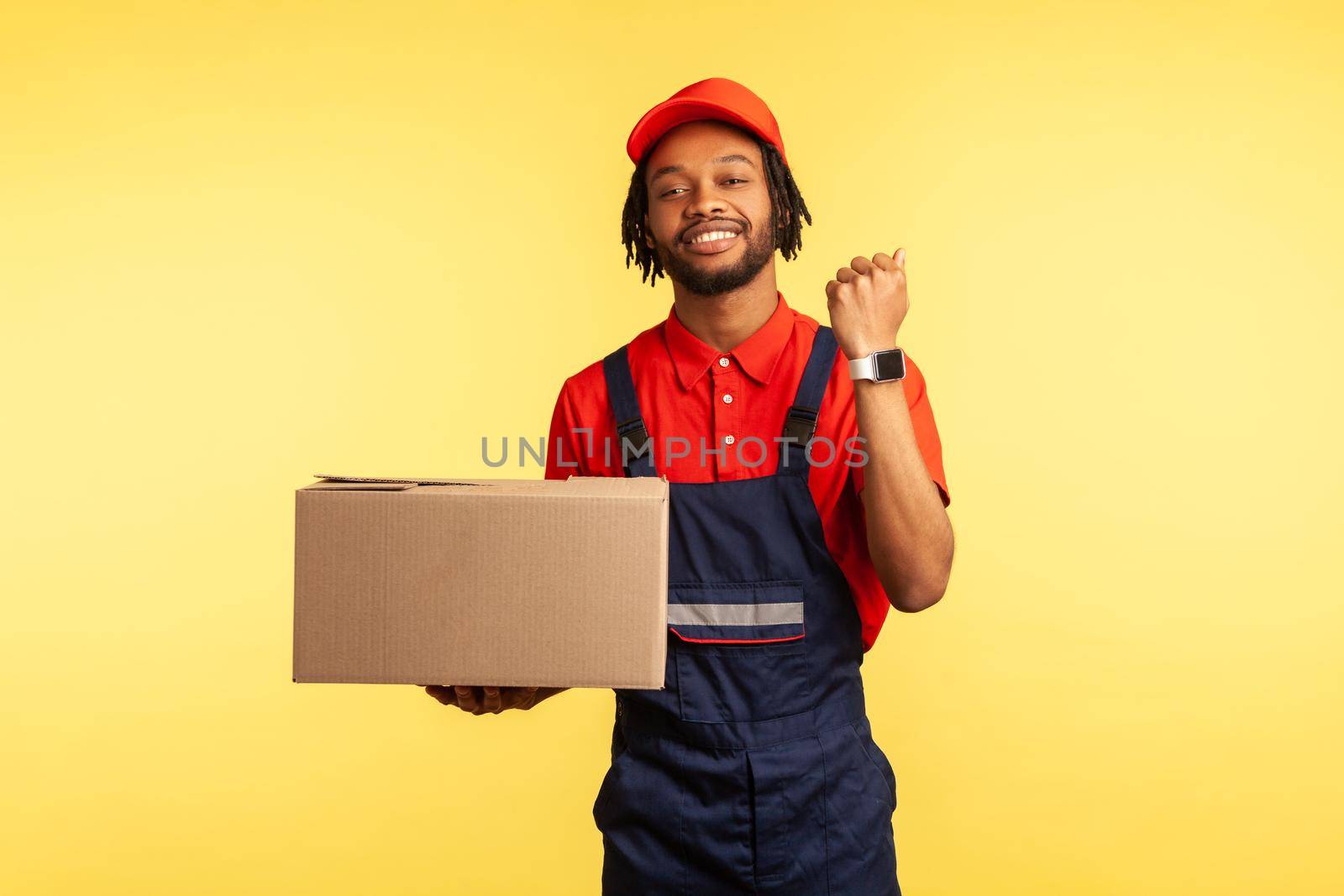 Deliveryman holds parcel and showing wristwatch, delivering in time, cargo transportation service. by Khosro1