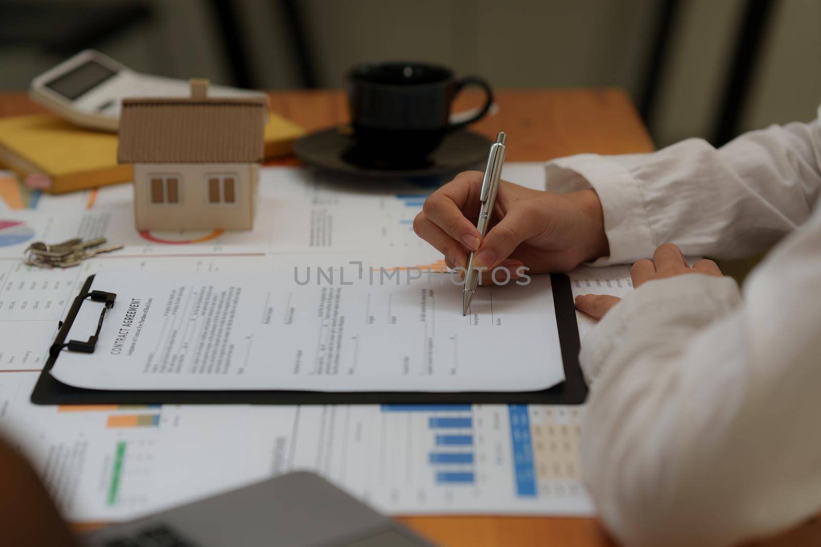 Business woman waiting signing agreement contract for buying house or condominium. Bank manager concept