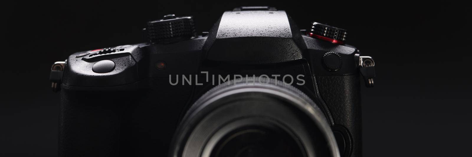 Close-up of modern model of photocamera, good quality of pictures, device for photoshots. Technology, development, studio, backstage, photography concept