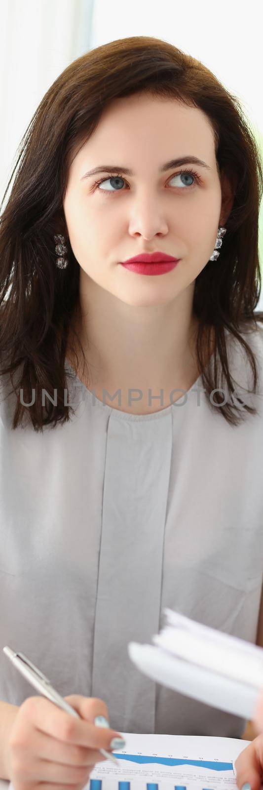 Portrait of pretty brunette female office worker listen to coworker ideas, colleagues discuss working moment. Prepare report in team. Cooperation concept