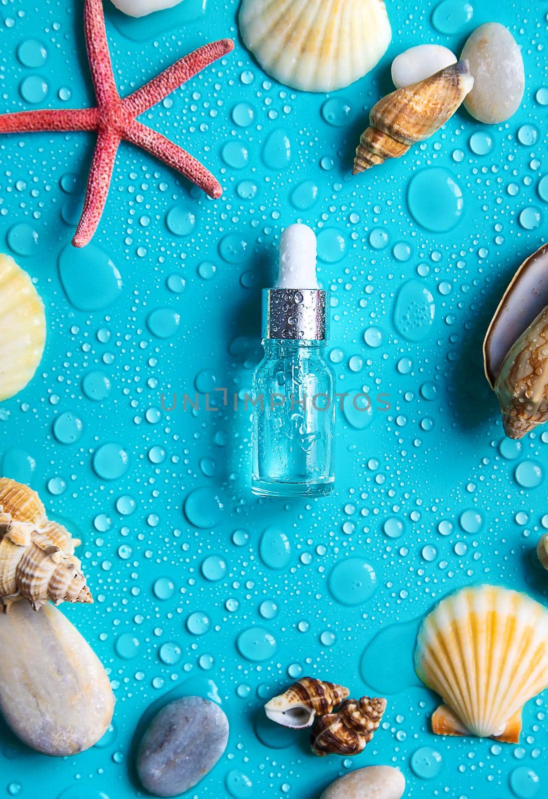 Moisturizing cosmetic product on sea background. Hyaluronic acid. Selective focus. by yanadjana