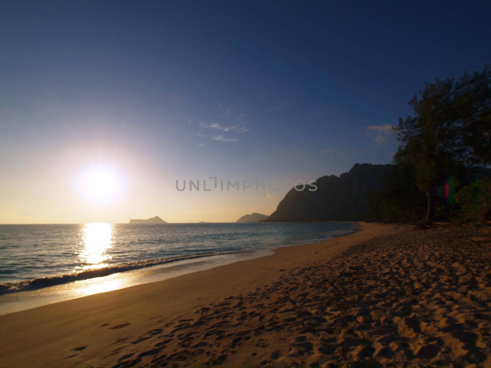 Early Morning Sunrise on Waimanalo Beach on Oahu, Hawaii over waimanalo bay with Rabbit and Rock islands visible.