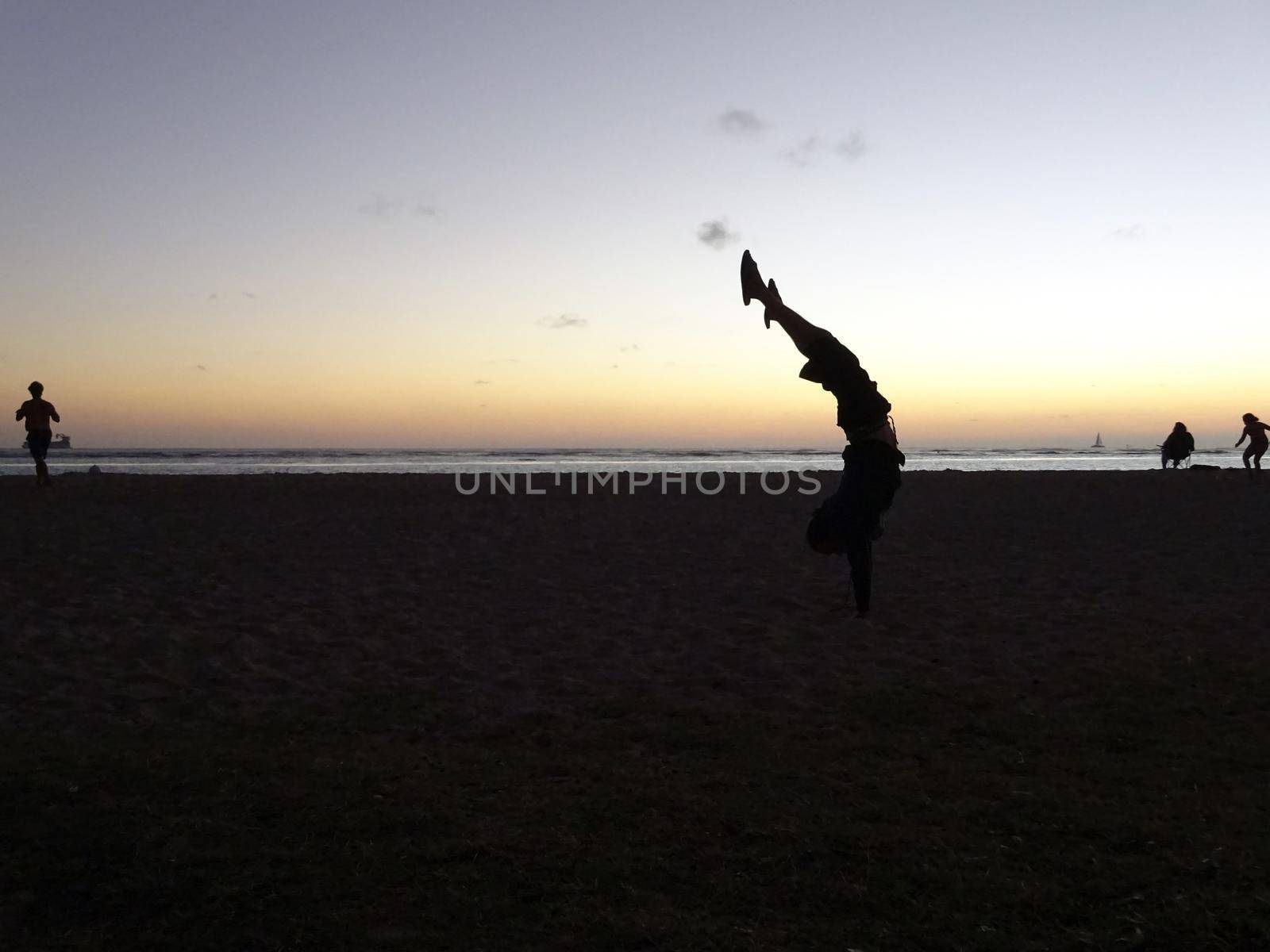 Man Handstands on Ala Moana Beach at Dusk by EricGBVD