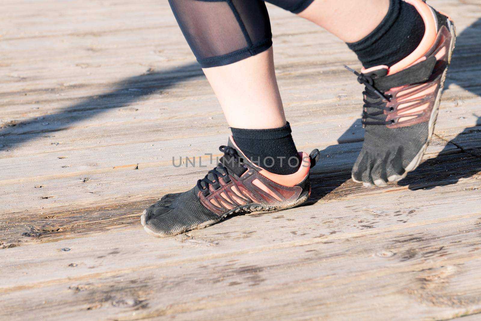 runner feet with five toes running shoes, barefoot sport concept and healthy lifestyle
