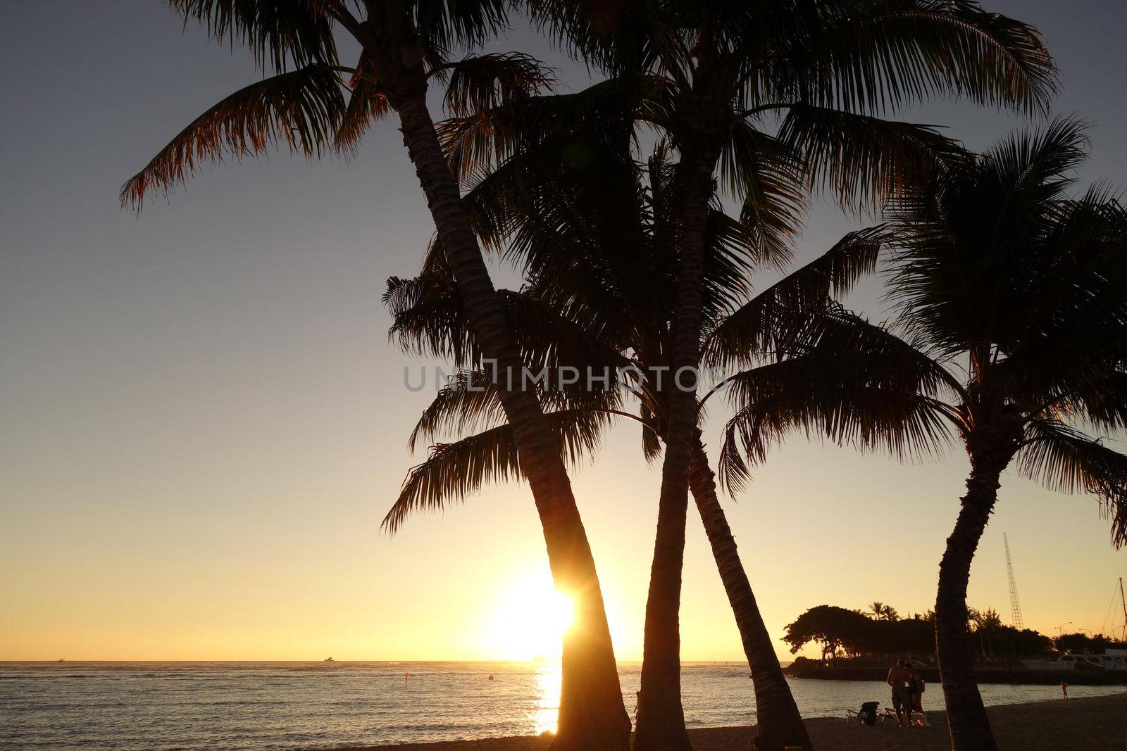 Sunset over the ocean at Ala Moana Beach Park by EricGBVD