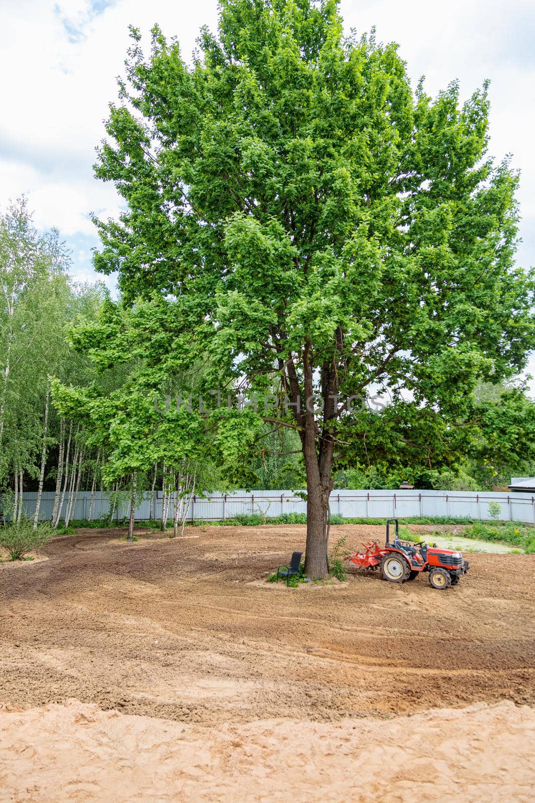 Minitractor on plowed and cultivated land
