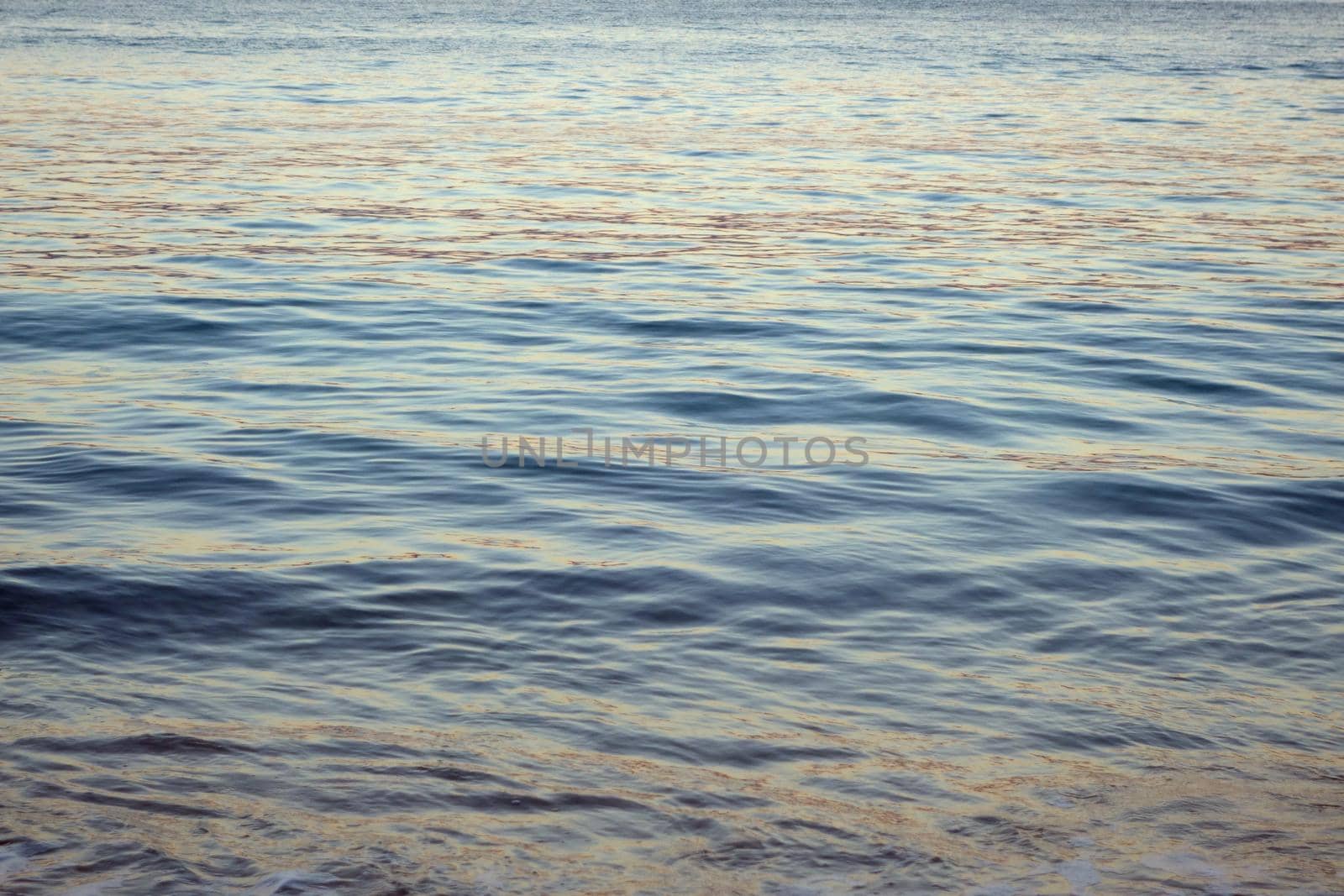 Ocean Water ripples off the coast of Oahu reflecting light.  Good for backgrounds textures.