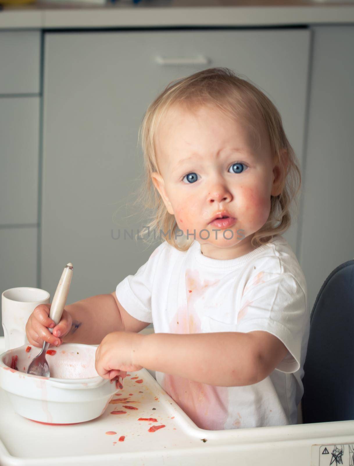 cute baby toddler learn to eat soup. High quality photo
