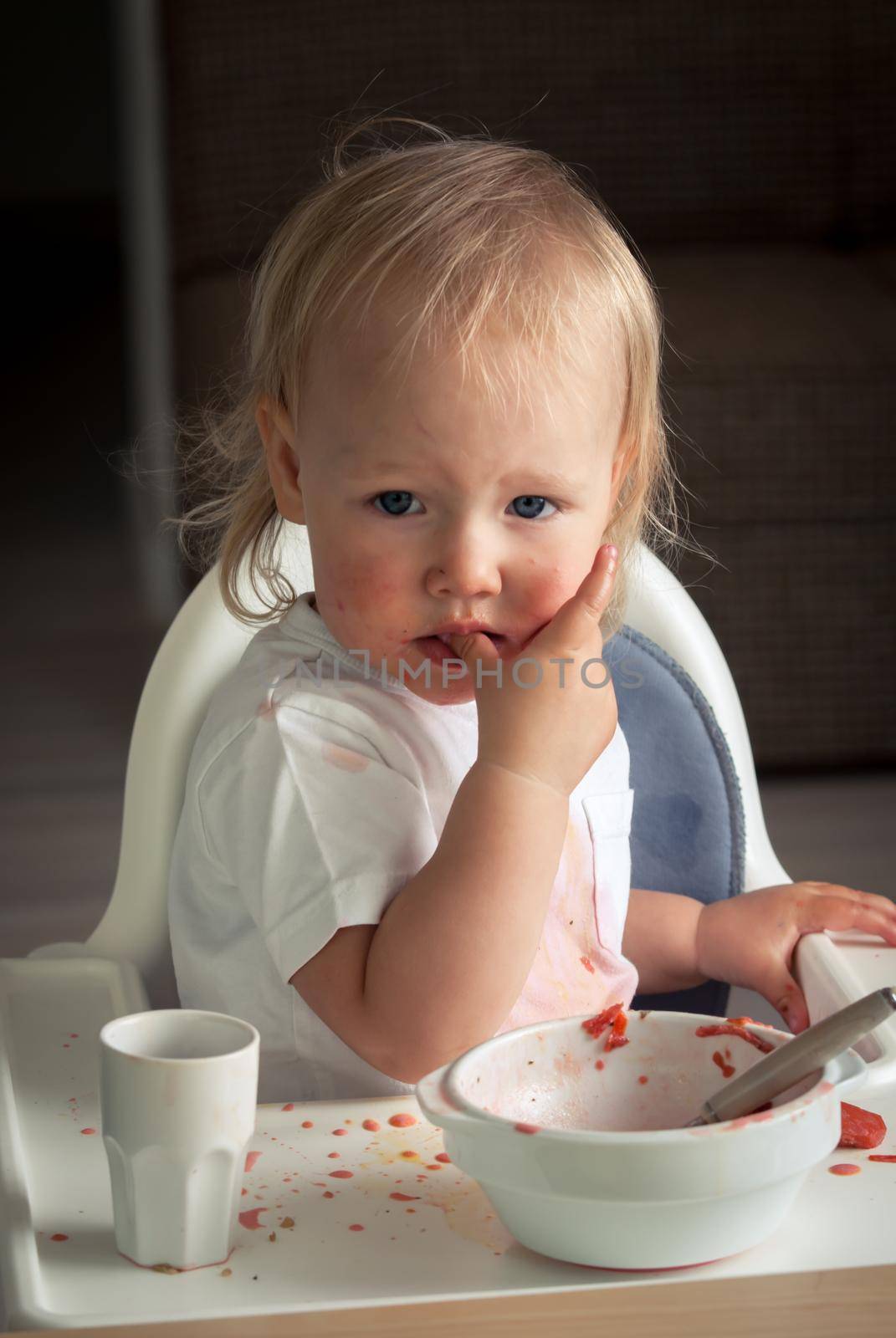 cute baby toddler learn to eat soup. High quality photo