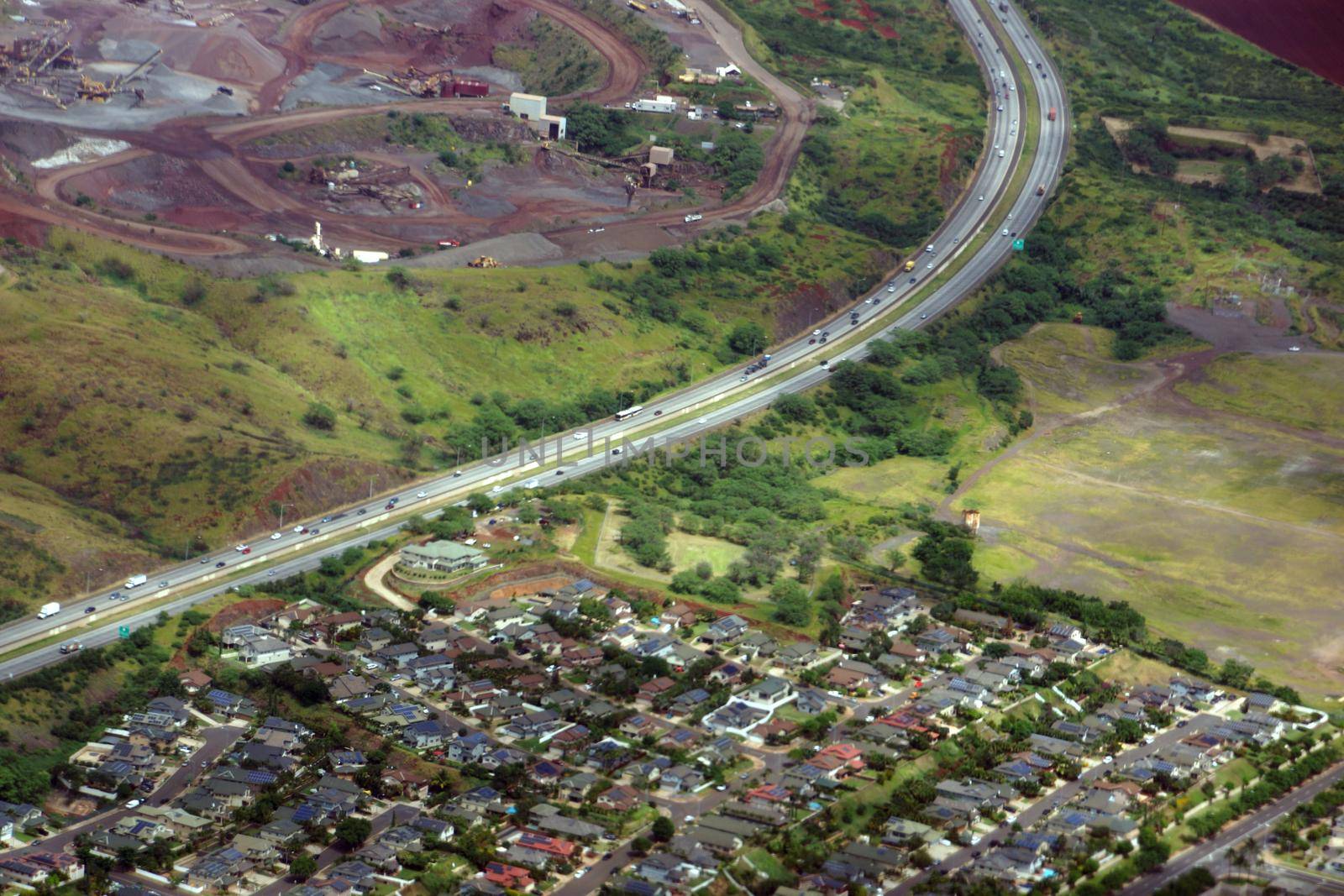 Aerial H-1 Interstate Highway running through Countryside into city by EricGBVD