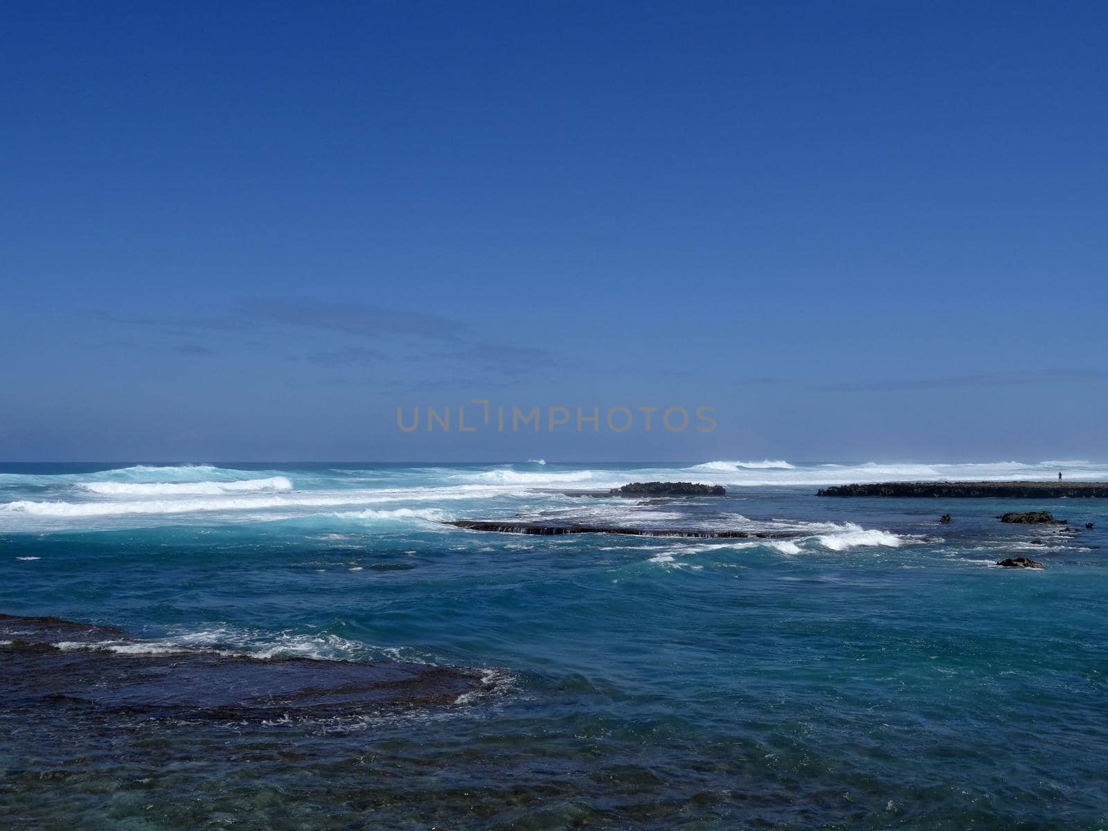 Waves roll into Kuilima Cove on the North Shore of Oahu, Hawaii.           