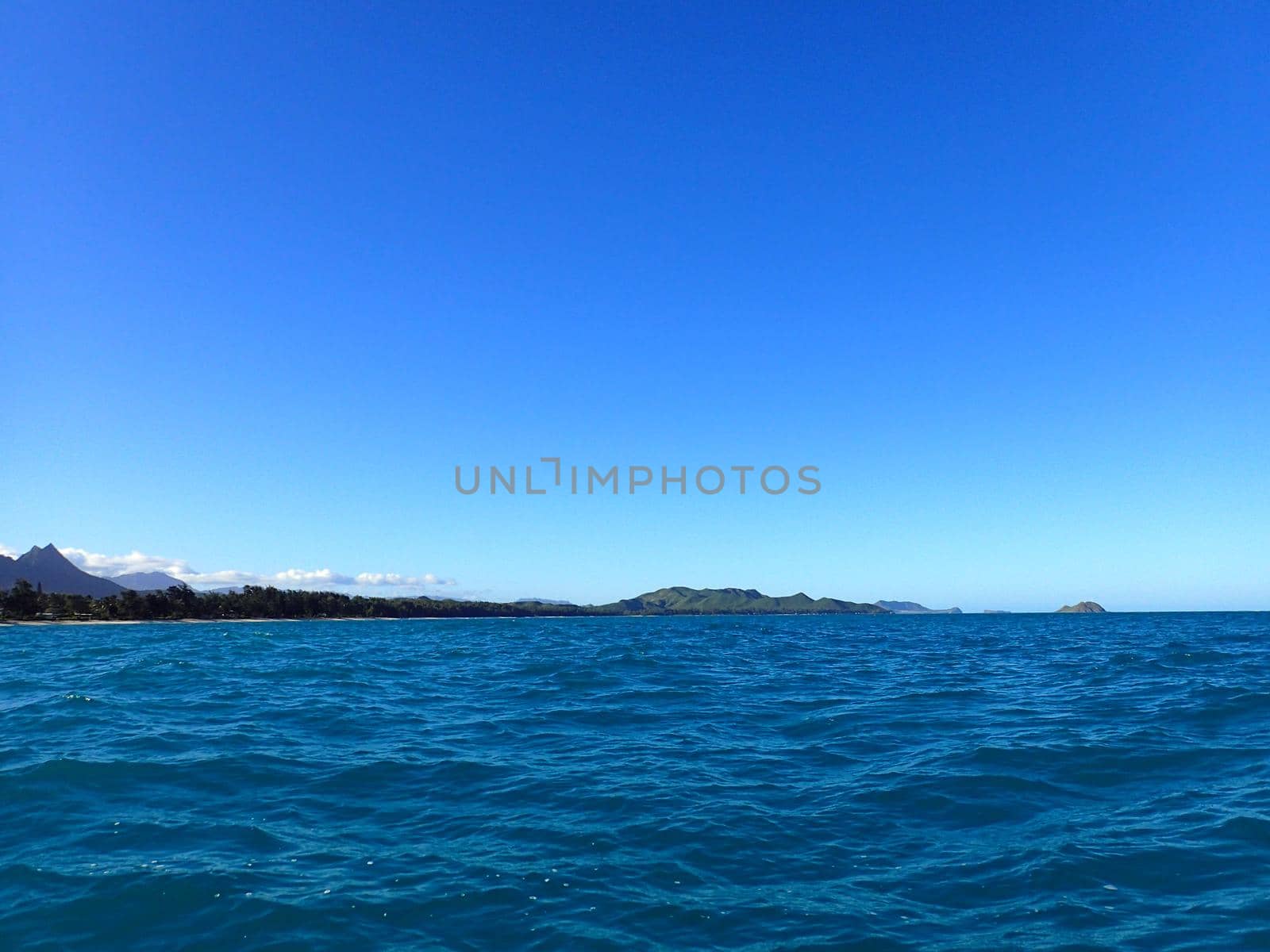 Bellows Beach and Na Mokulua Islands seen from the waters of Waimanalo Bay.