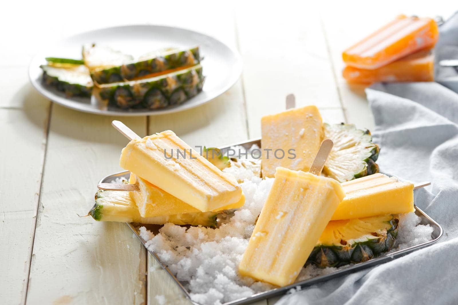 Delicious Homemade Pineapple Popsicles on Ice Cubes 