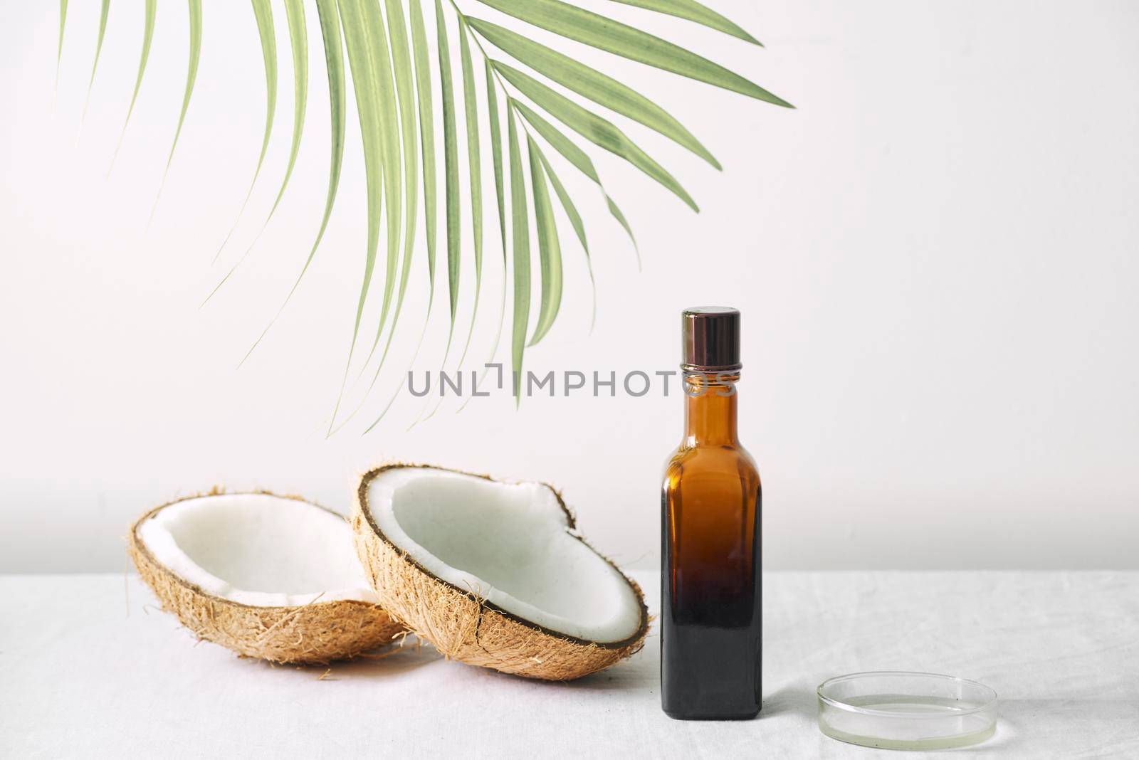 Spa cosmetics in brown glass bottles on gray concrete table. Copy space. Beauty blogger, salon therapy, minimalism concept