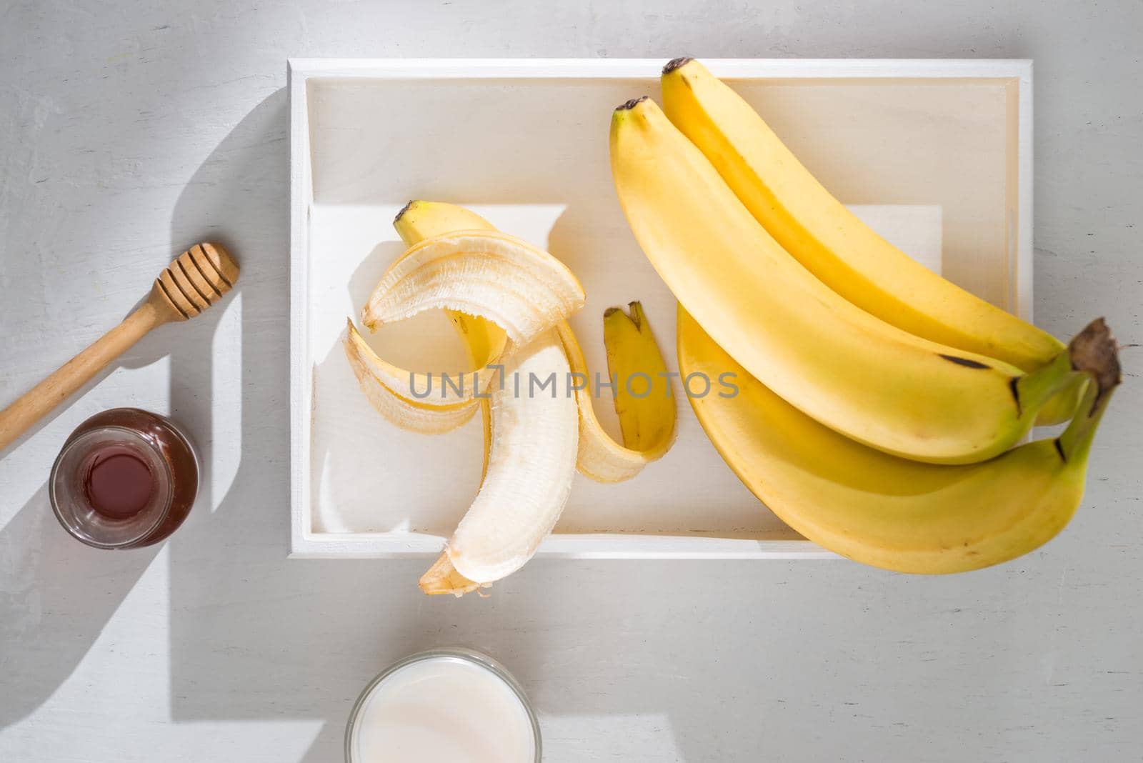 a sliced banana in a bowl on wooden background