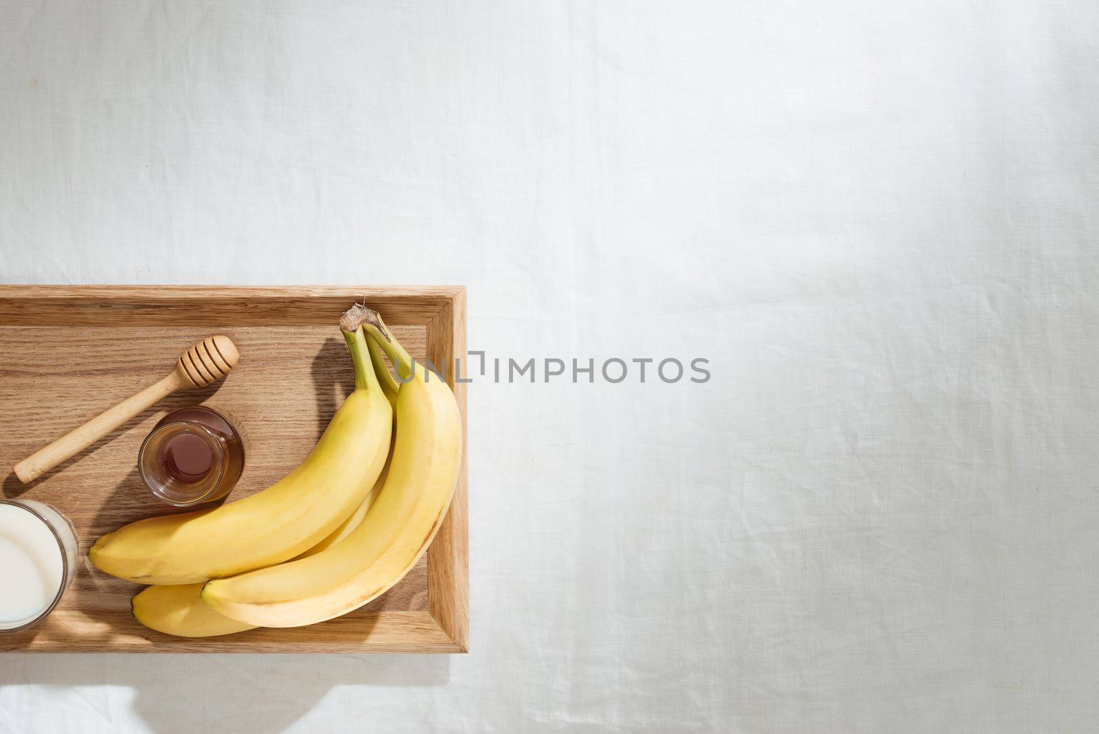 Bananas and banana pieces in a wooden plate