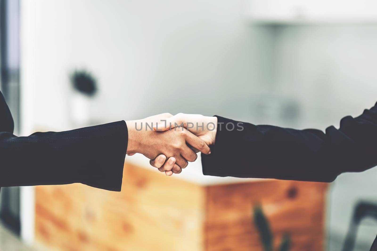 business merger, Asian businesswoman shake hands at the conference room with showcase their collaboration to strengthen their marketing efforts